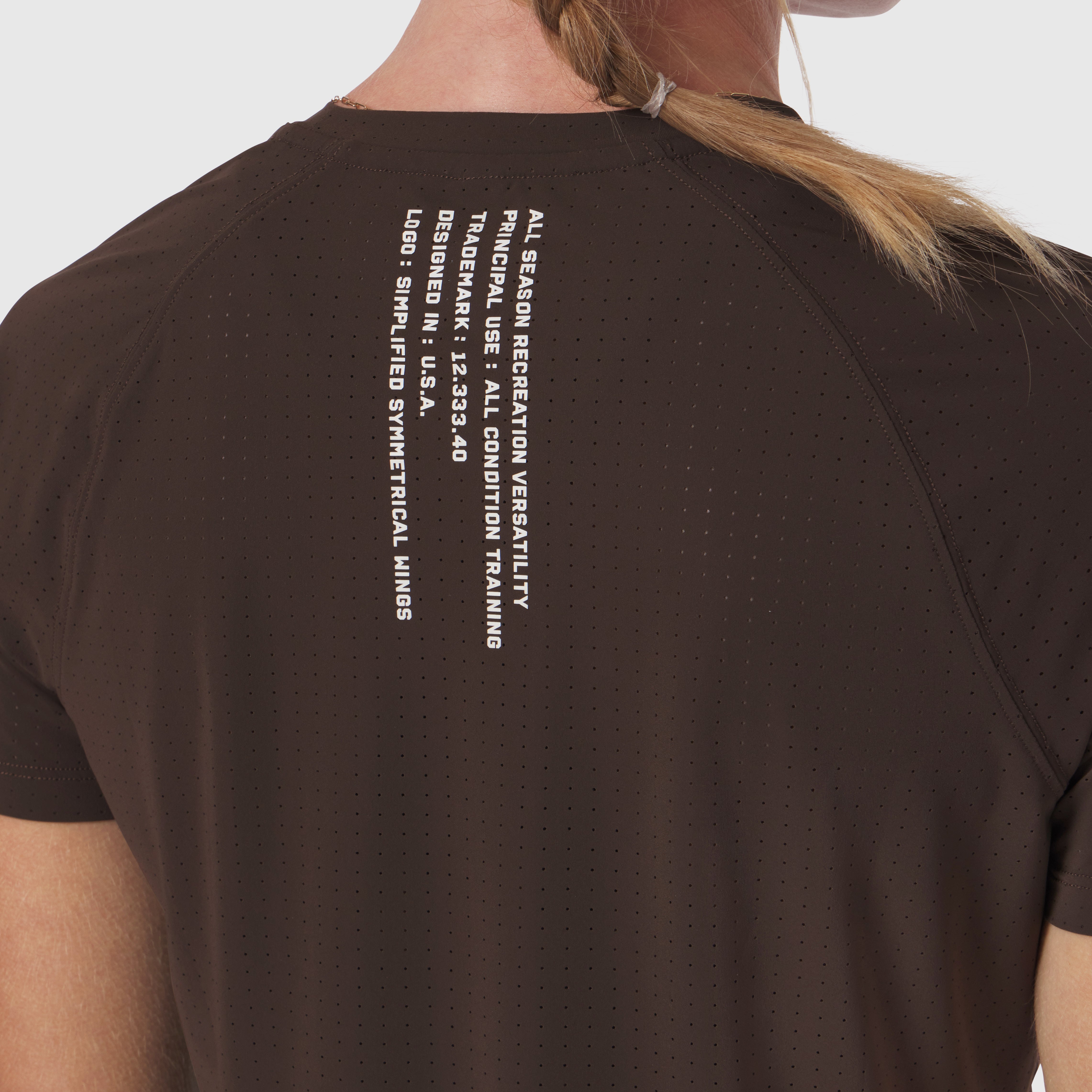 Laser-Vent Established Tee in dark earth worn by model, back view showing text graphic