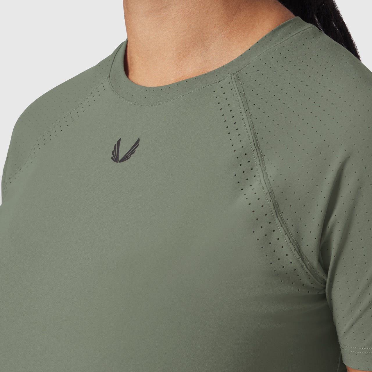 Laser-Vent Established Tee in sage worn by model, front detail view