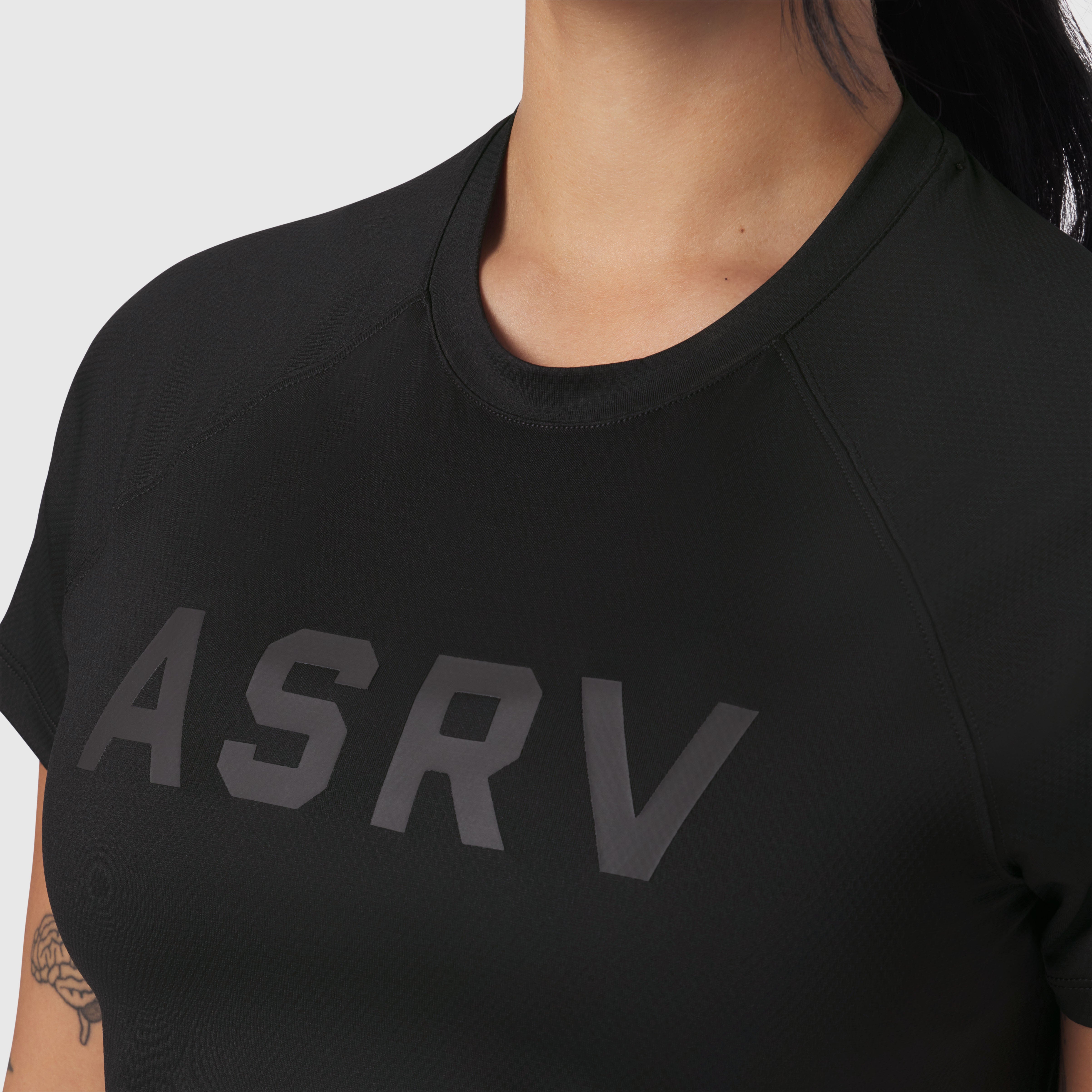 AeroSilver Cropped Tee in black with ASRV logo, worn by model, front view