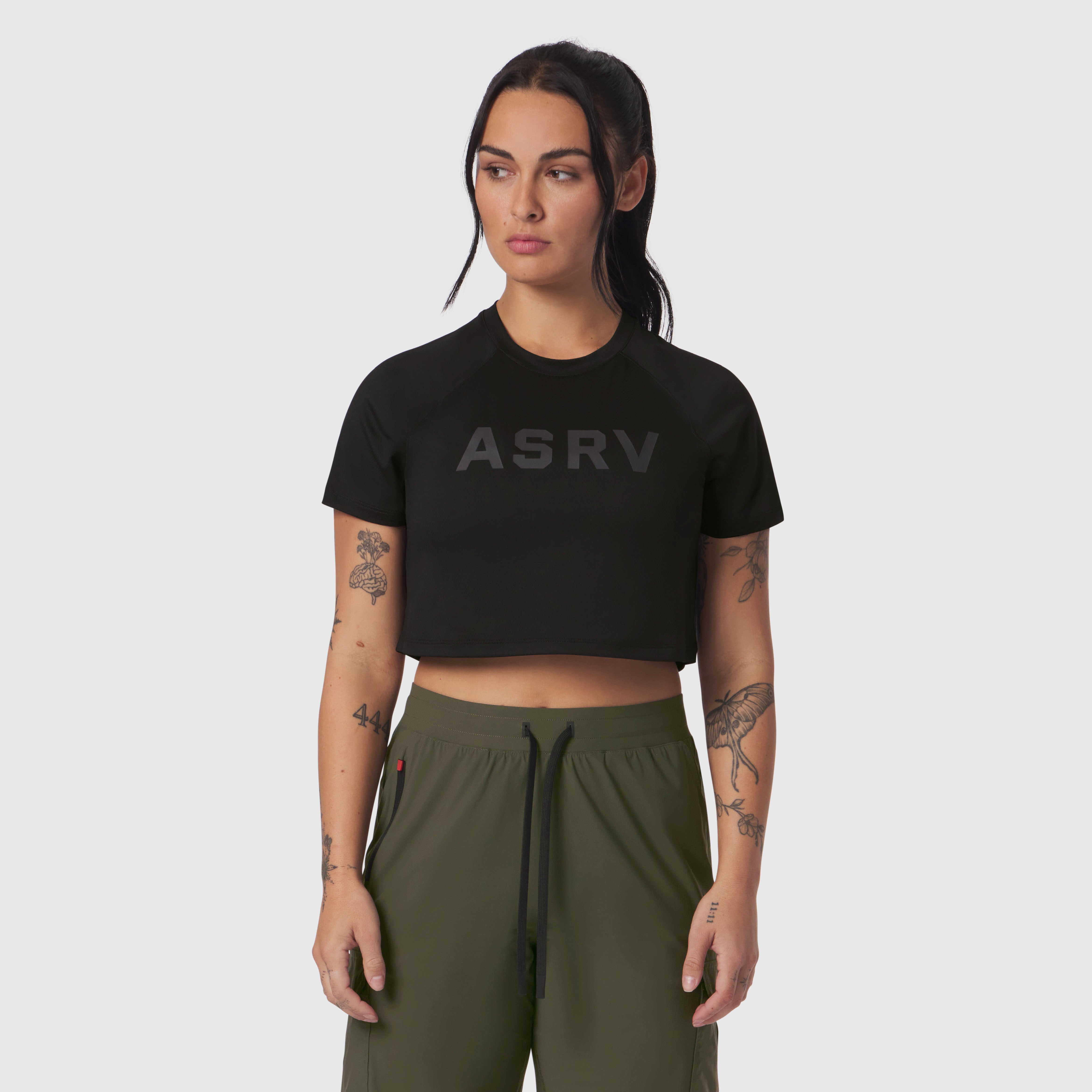 Black ASRV cropped tee worn with olive joggers, front view on model