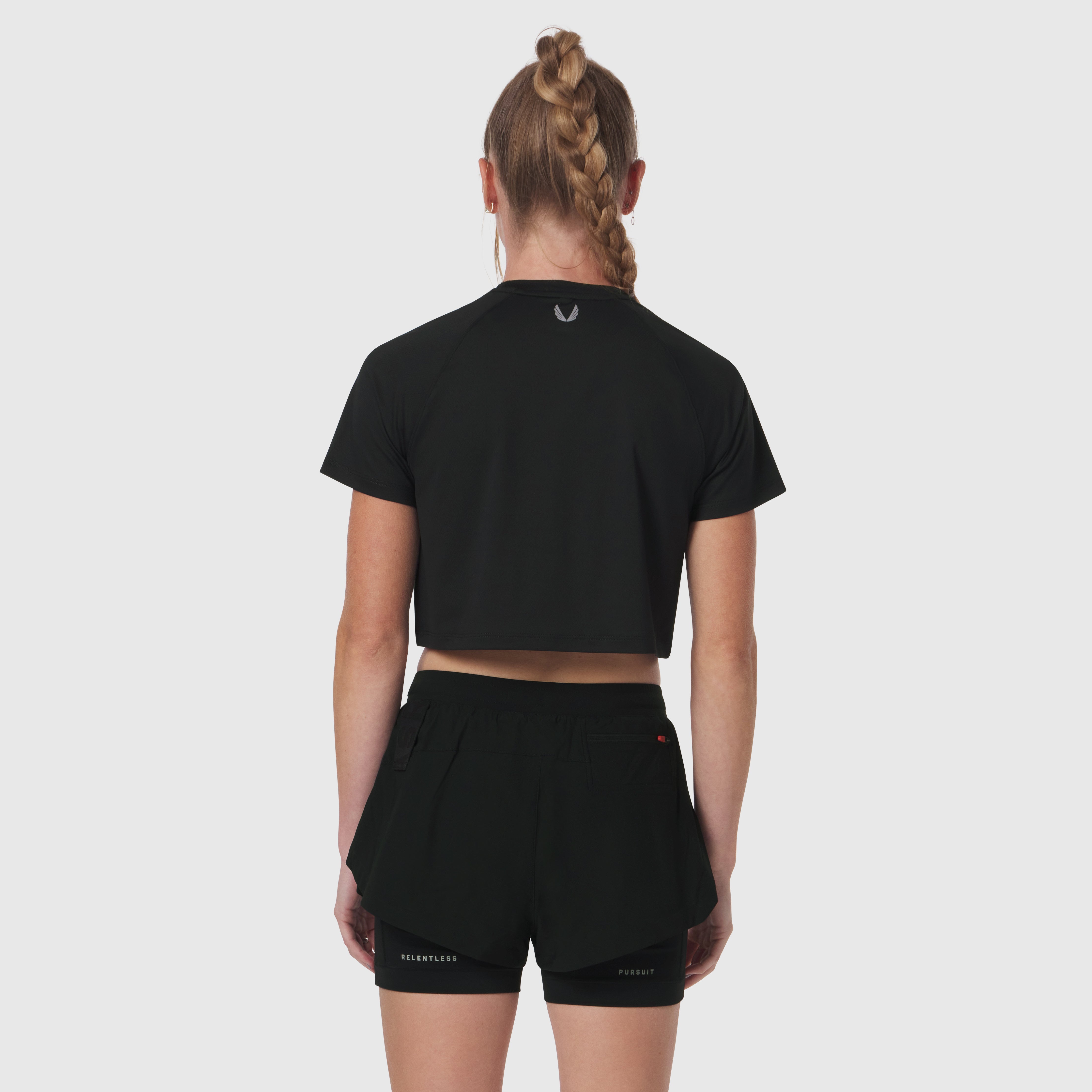 Black AeroSilver® cropped tee worn by model, back view