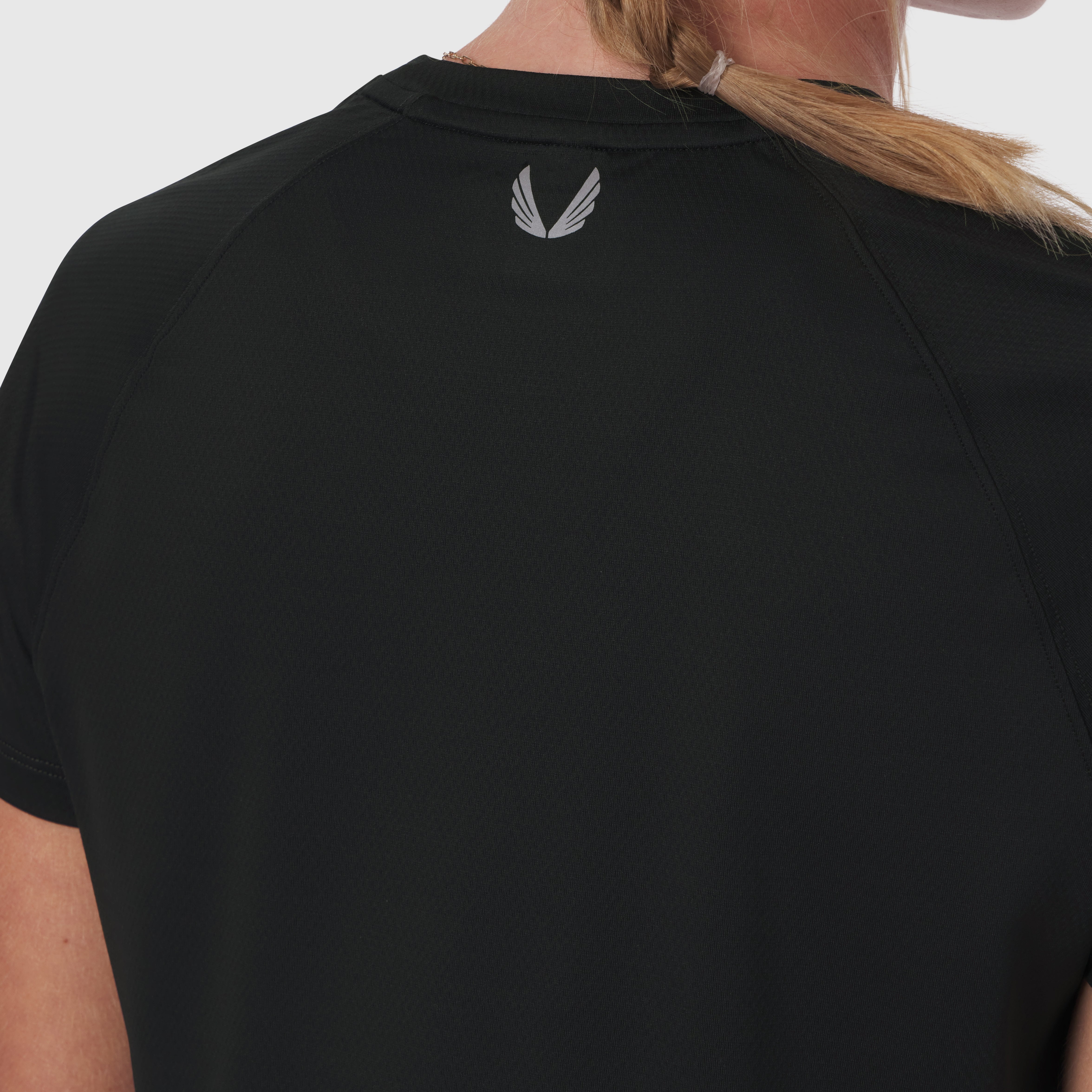 AeroSilver Cropped Tee in black, back view on model