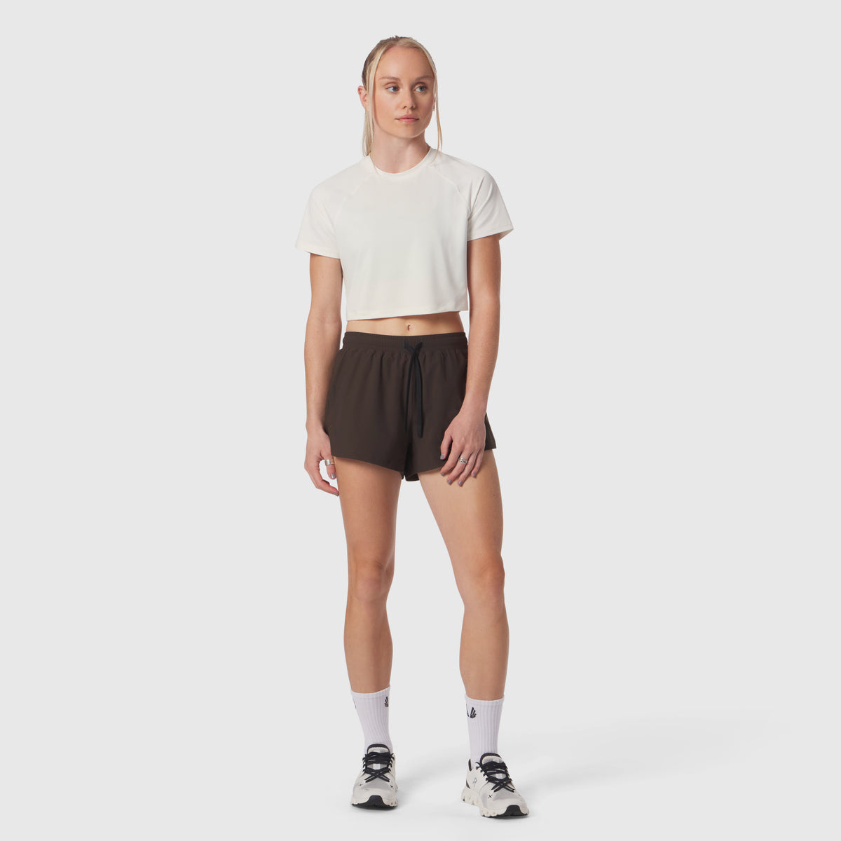 AeroSilver® Cropped Tee in ivory cream, worn with black shorts and white socks, front view