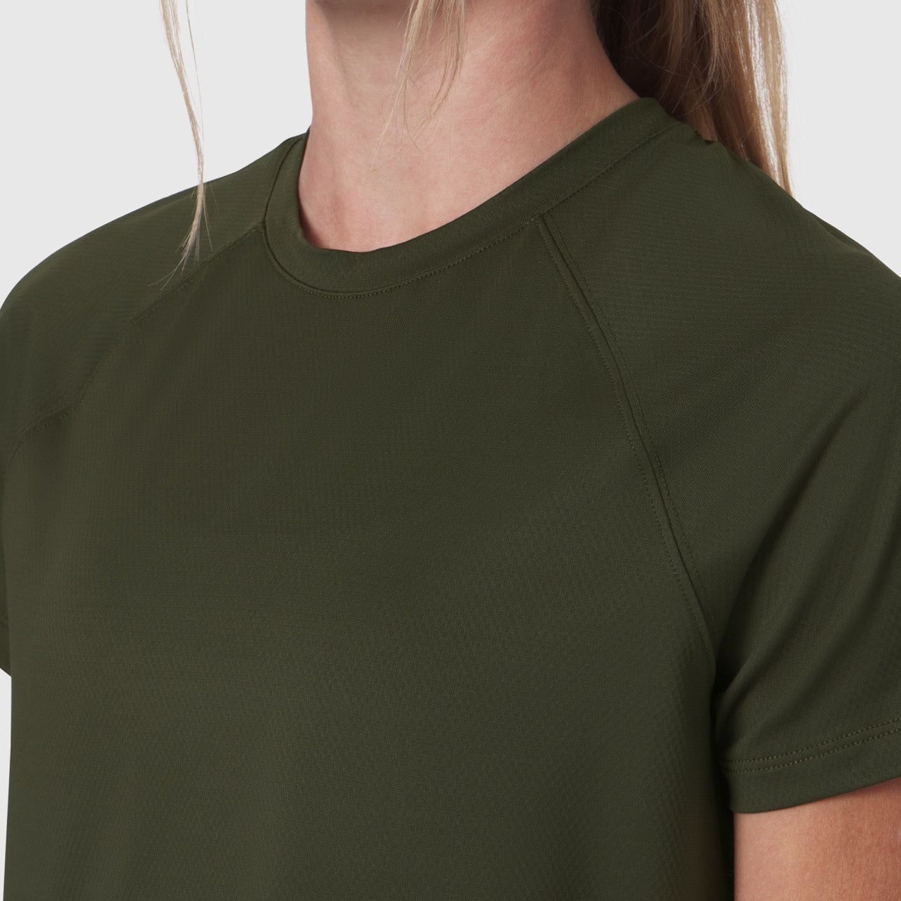 AeroSilver Cropped Tee in olive, worn by model, front detail view