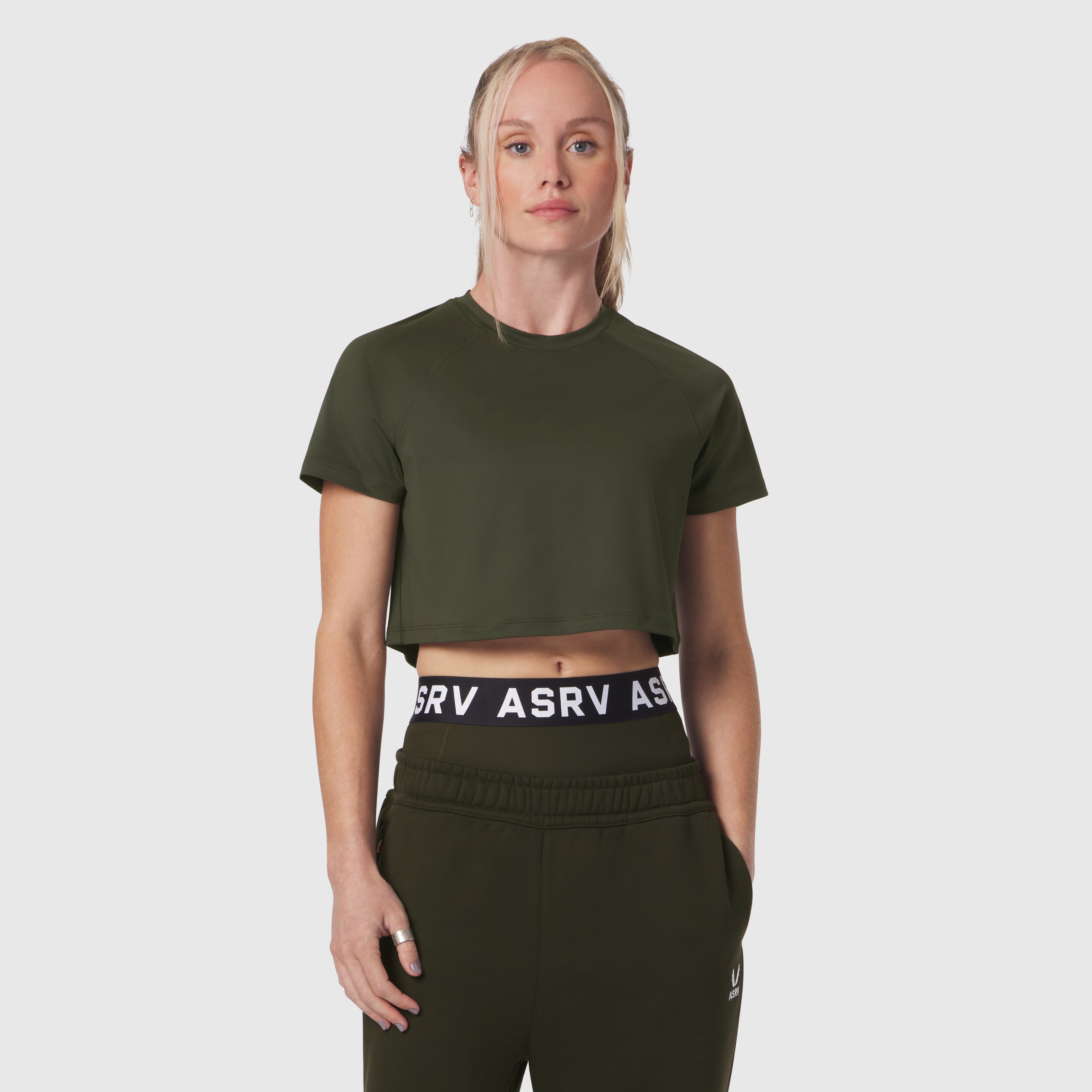 AeroSilver Cropped Tee in olive worn with matching joggers, front view