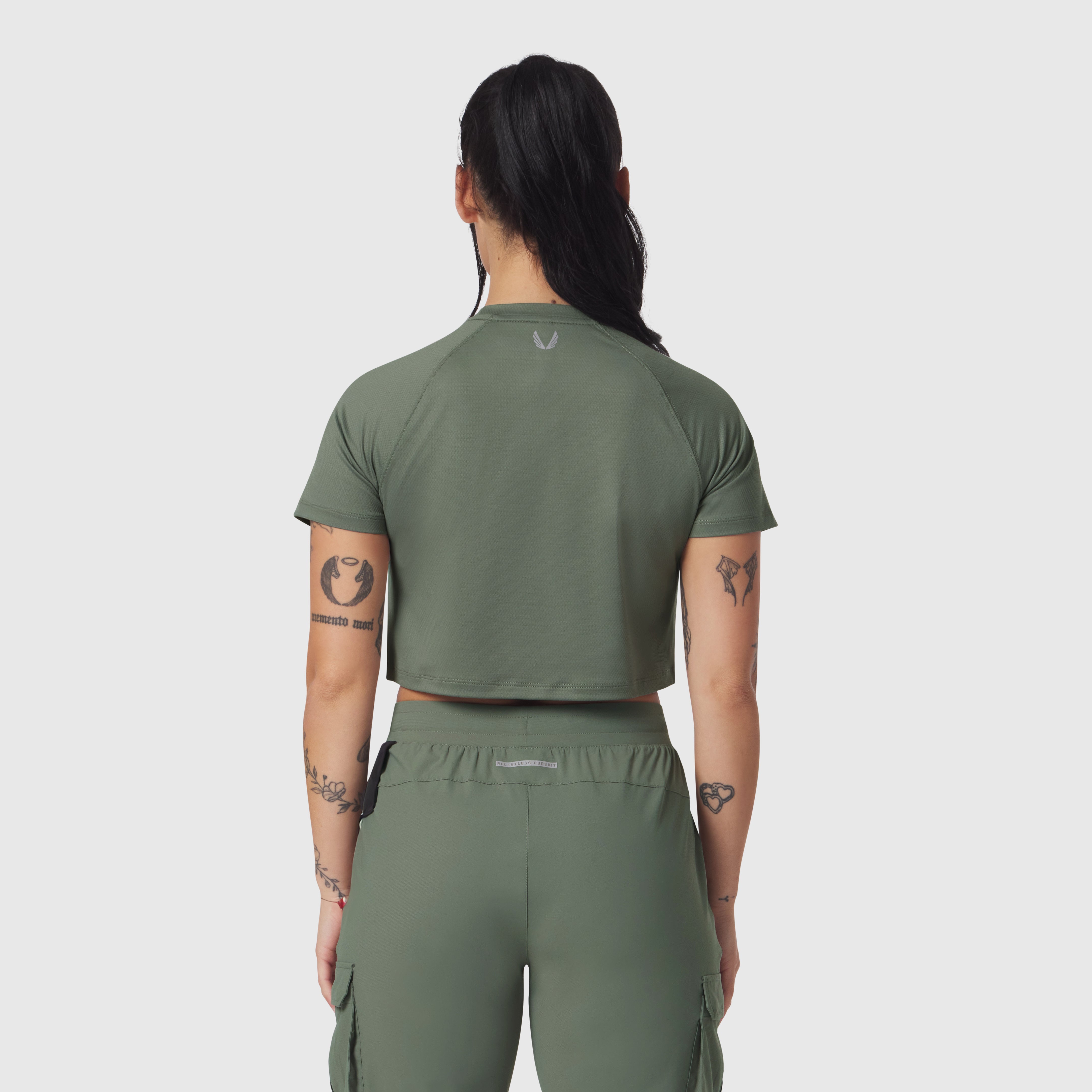 AeroSilver Cropped Tee in sage, back view on model