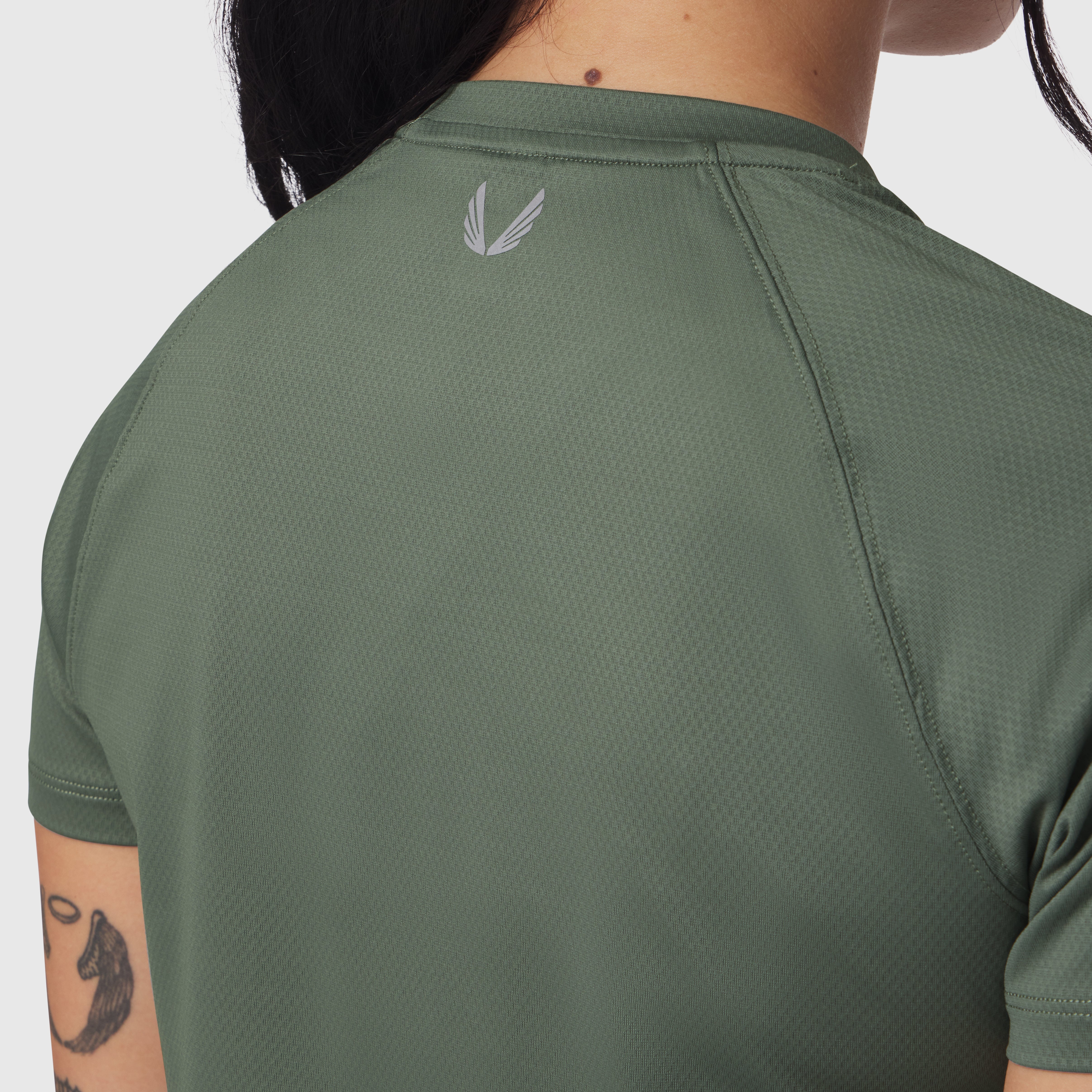 AeroSilver Cropped Tee in sage, back view on model