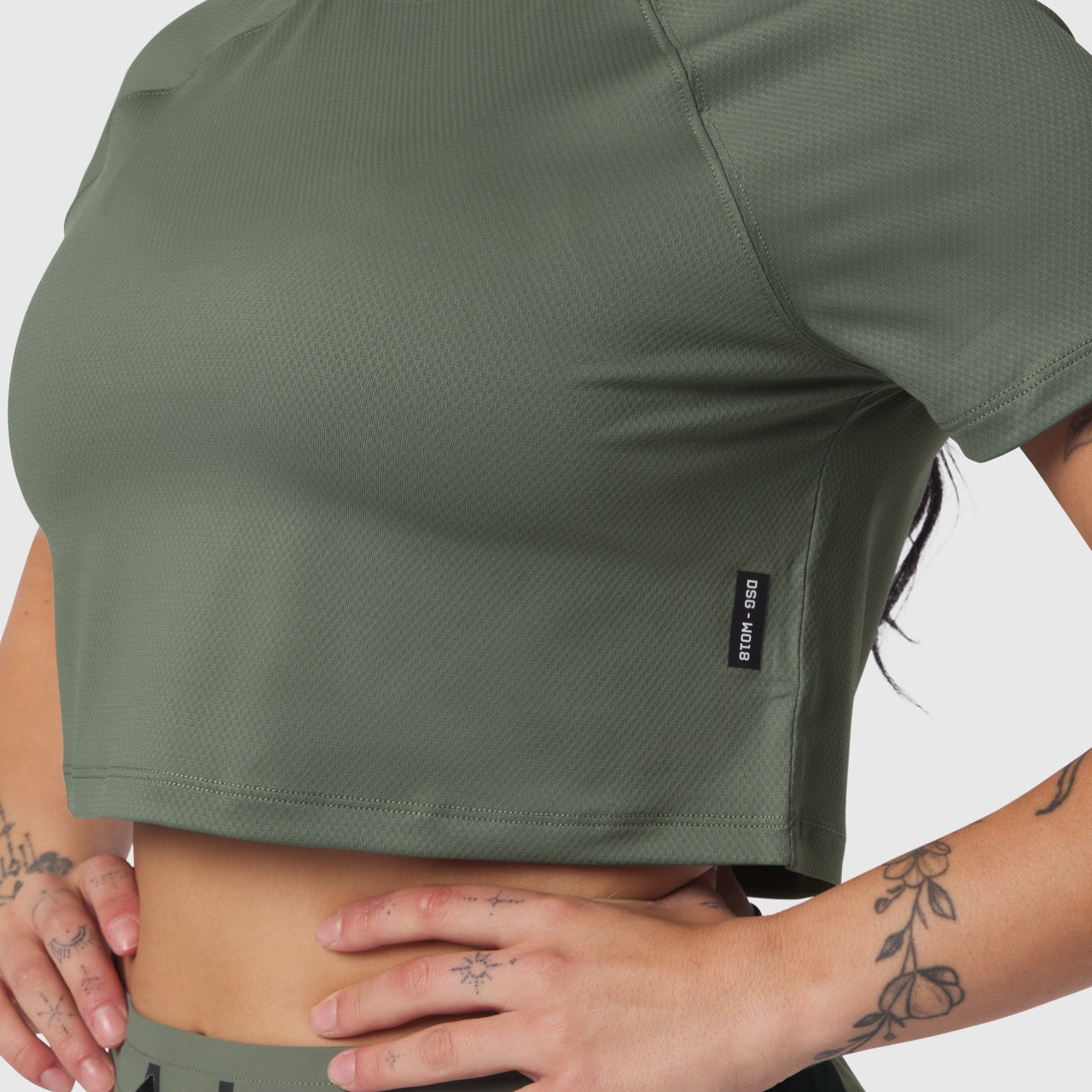 AeroSilver® Cropped Tee in sage worn by model, front view with hands at sides