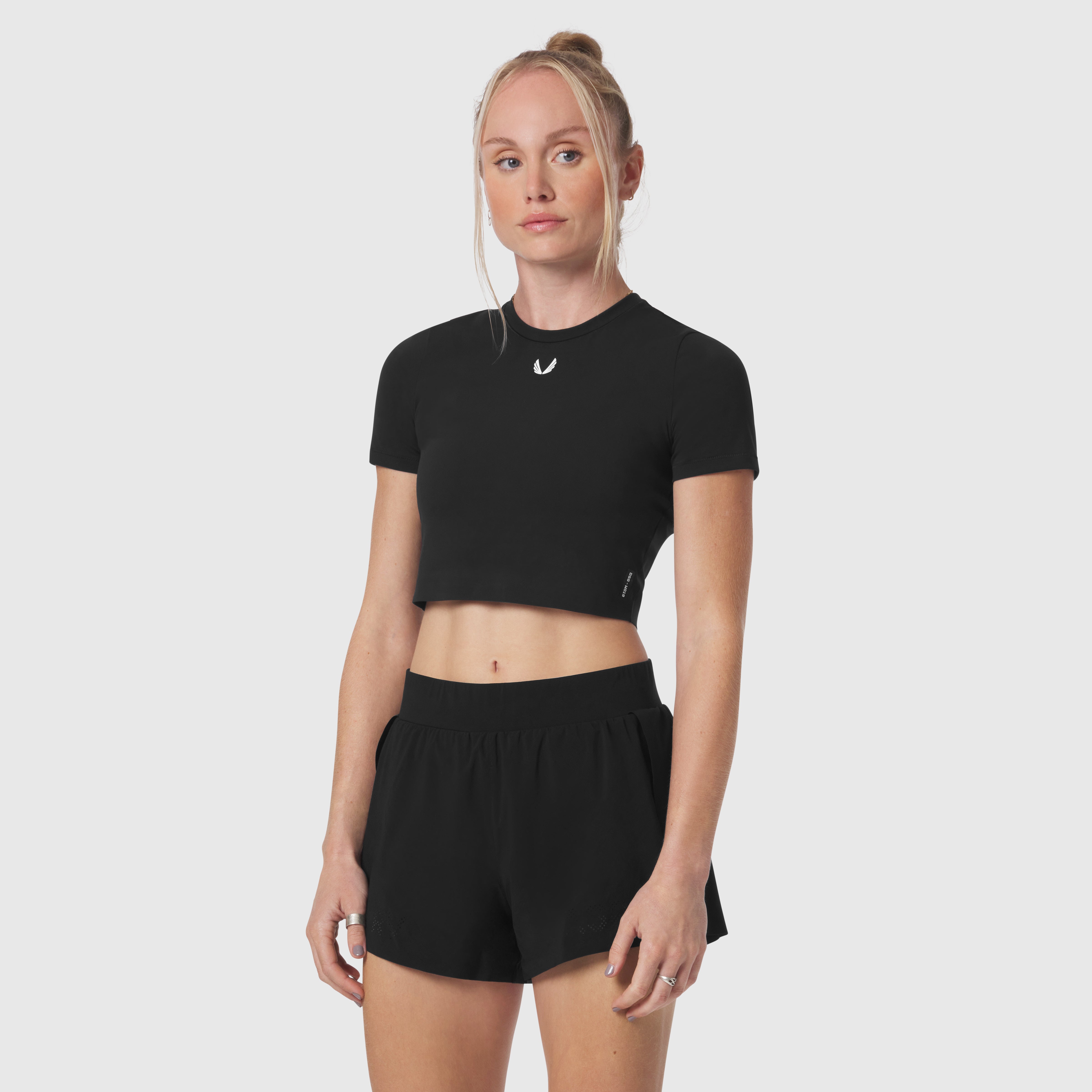 Black LYCRA® cropped tee worn by model, front view