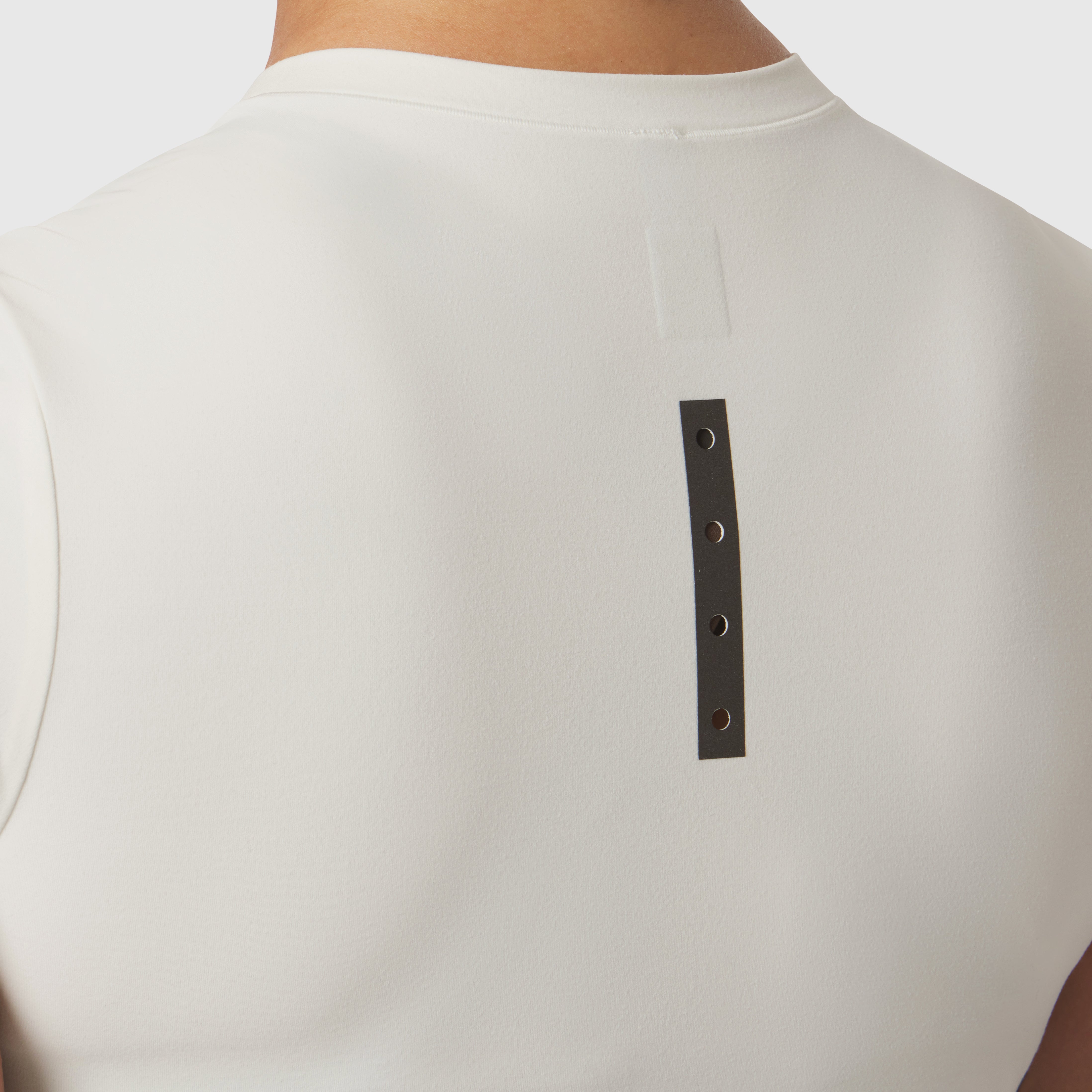 LYCRA® Cropped Tee in ivory cream worn by model, back view with black label detail