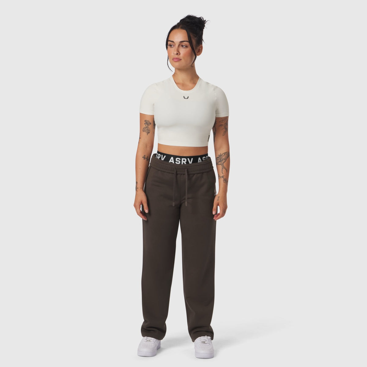 Ivory cream LYCRA® cropped tee worn with brown joggers, front view on model