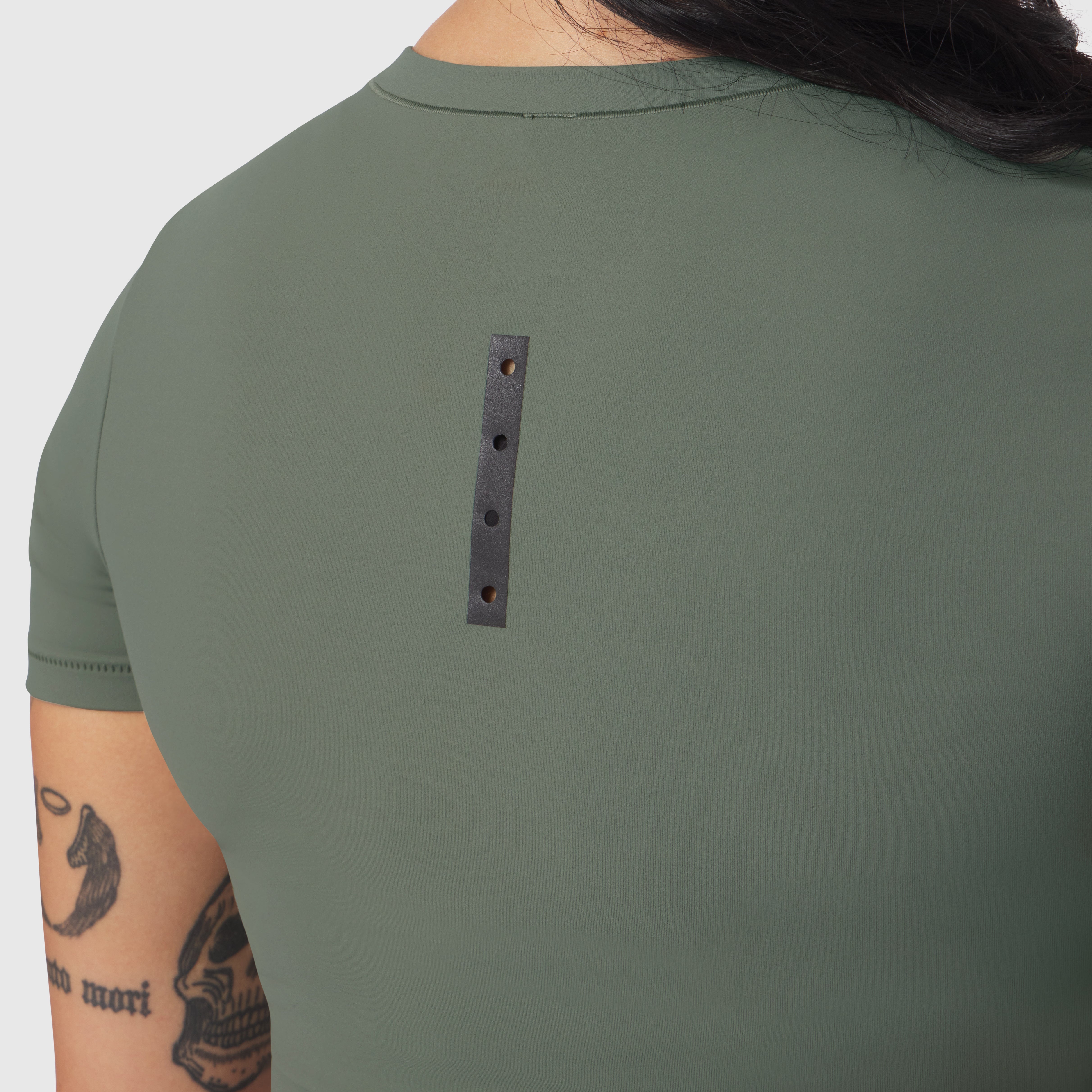 LYCRA® Cropped Tee in sage worn by model, back view showing detail patch