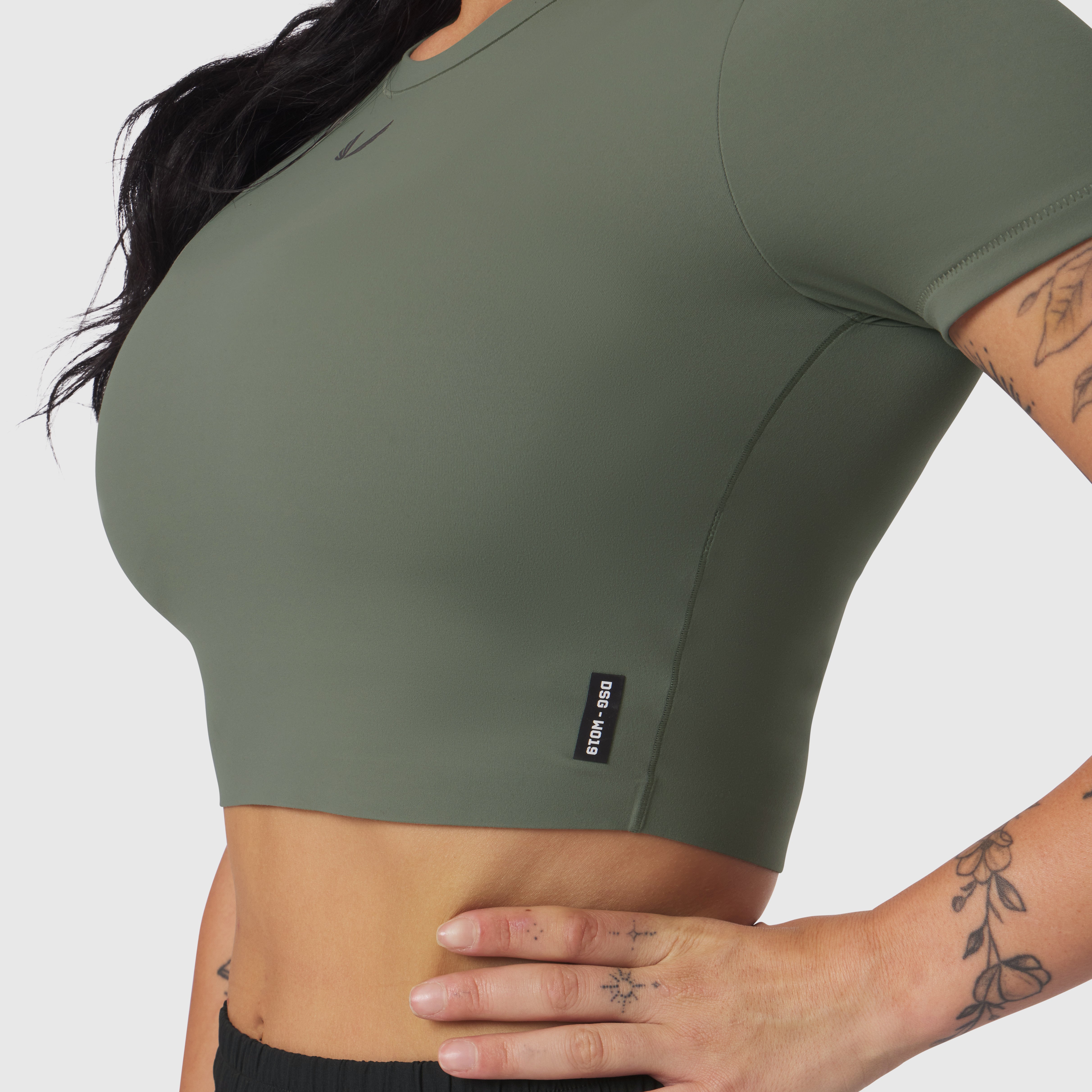 W019 Lycra Cropped Tee in sage worn by model, side view