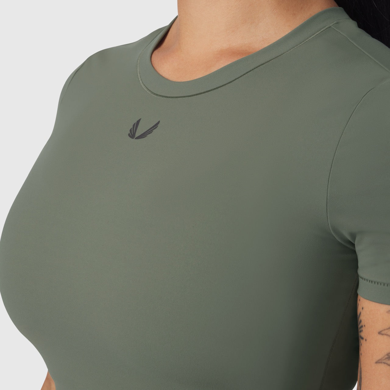 LYCRA® Cropped Tee in sage worn by model, front view detail