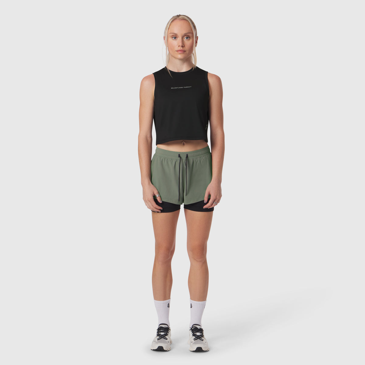 Black AeroSilver Tank Top worn with sage green shorts, front view on model