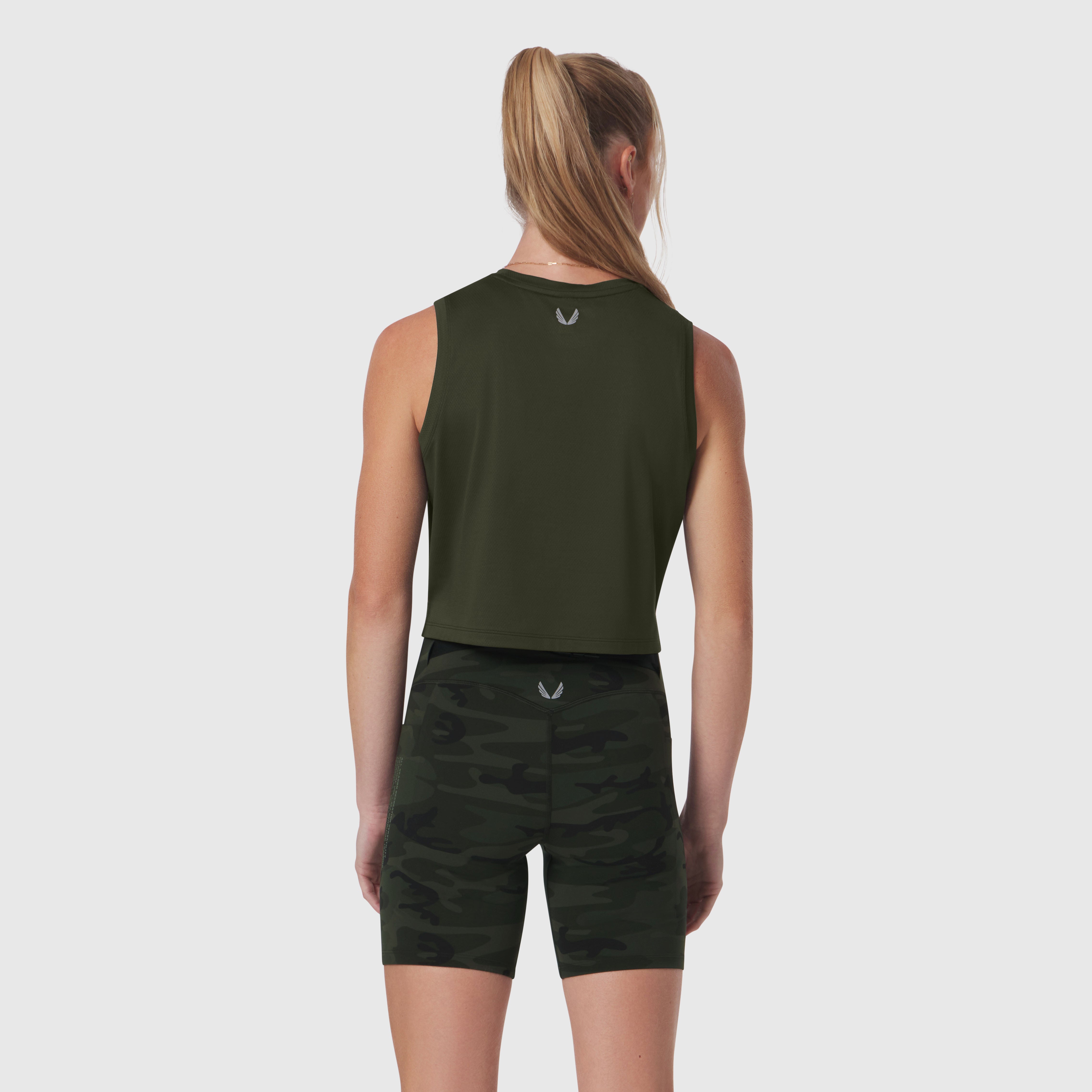 AeroSilver® Tank Top in olive worn with black camo shorts, back view