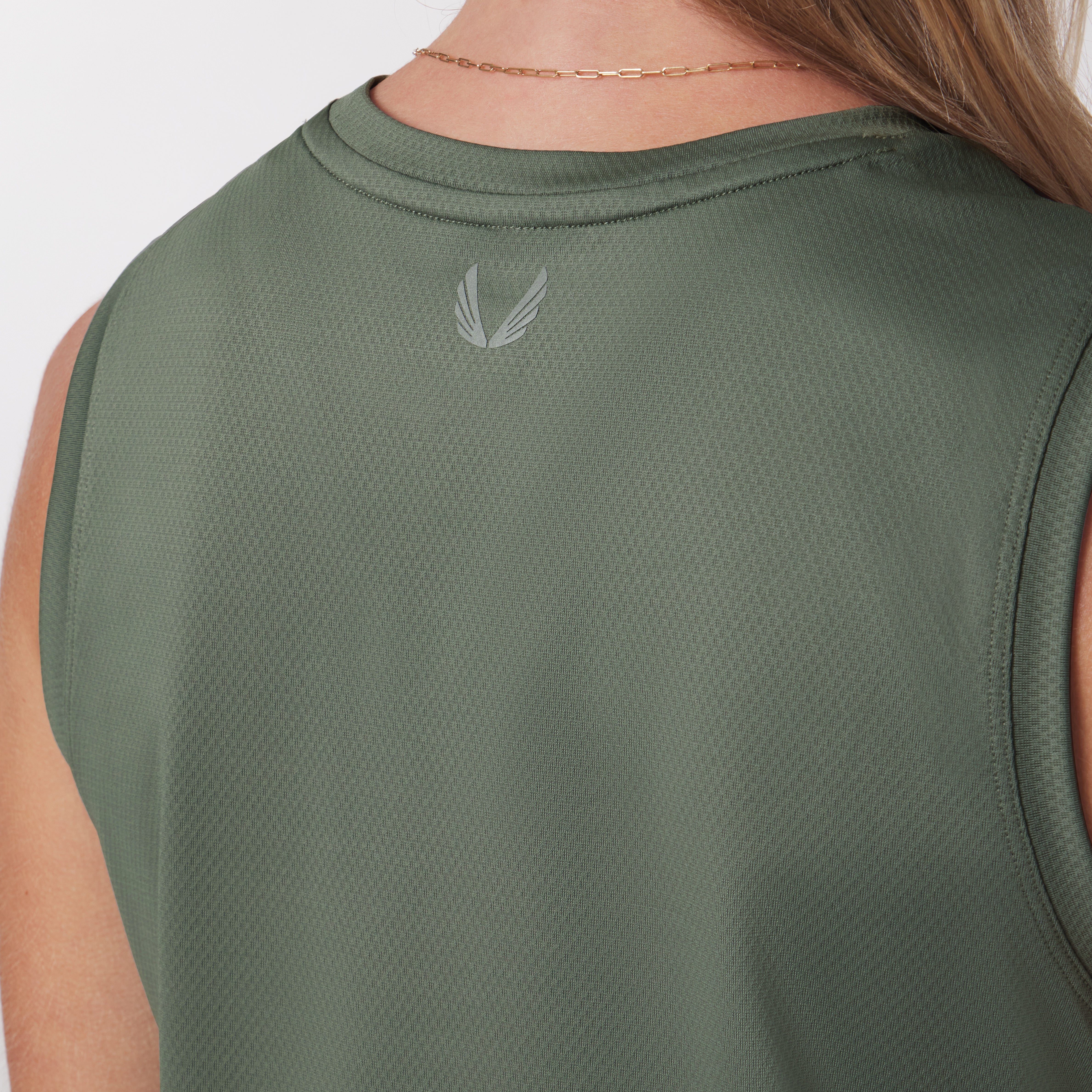 AeroSilver® Tank Top in sage green, worn by model, back view showing logo