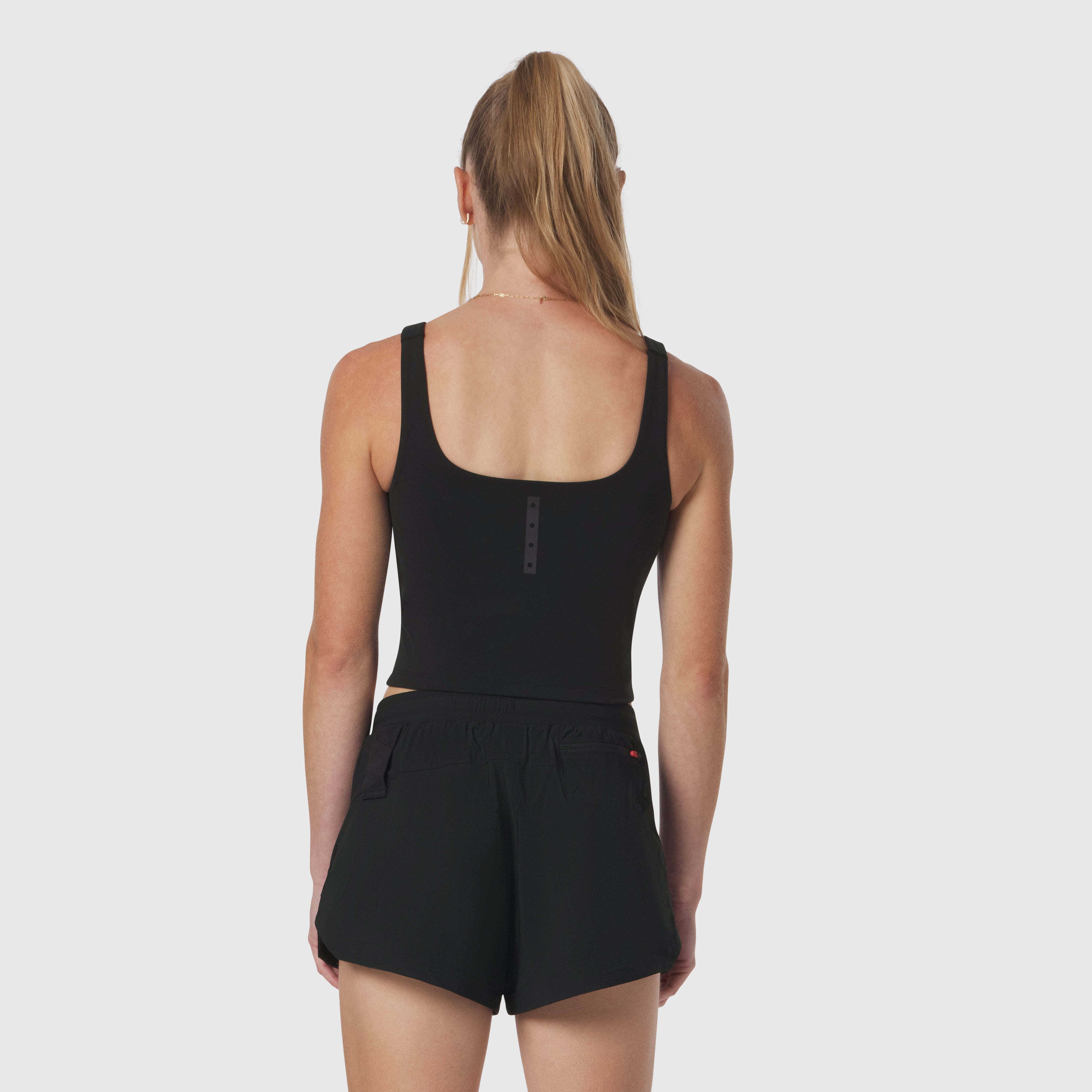 W022 LYCRA® 2-in-1 tank top in black, back view on model
