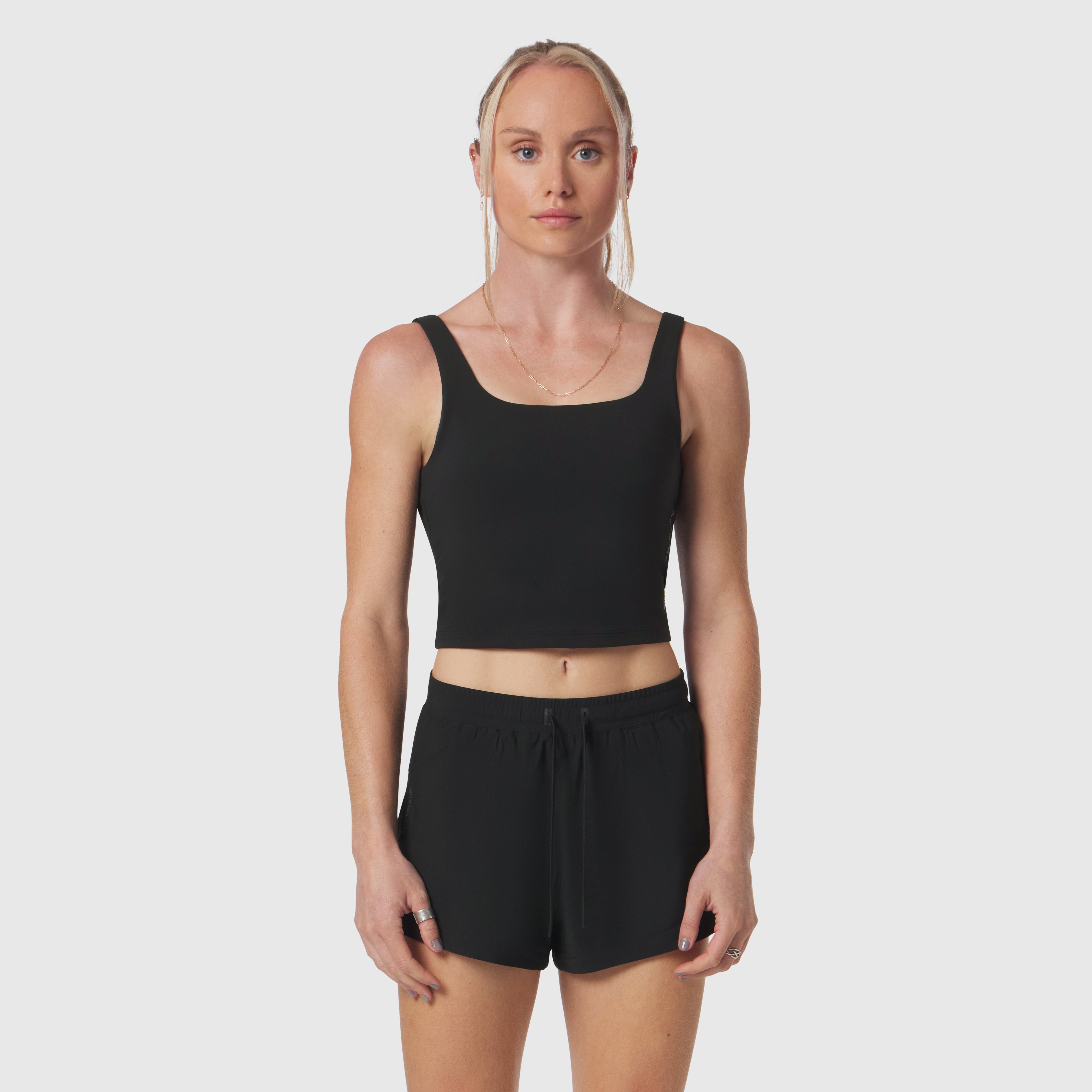 Black LYCRA® 2-in-1 tank top worn by model, front view