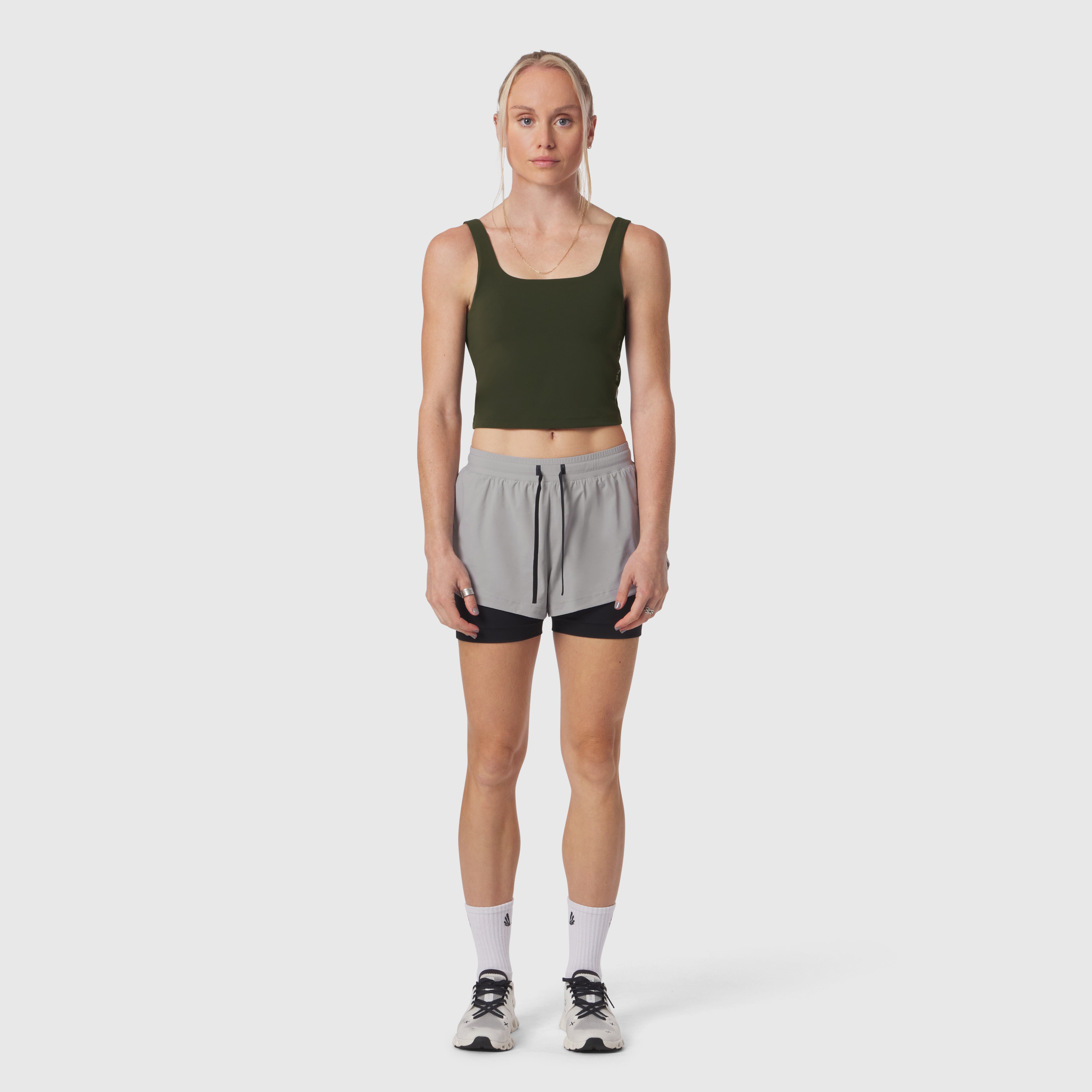 W022 LYCRA® 2-in-1 Tank Top in olive worn with grey shorts, front view