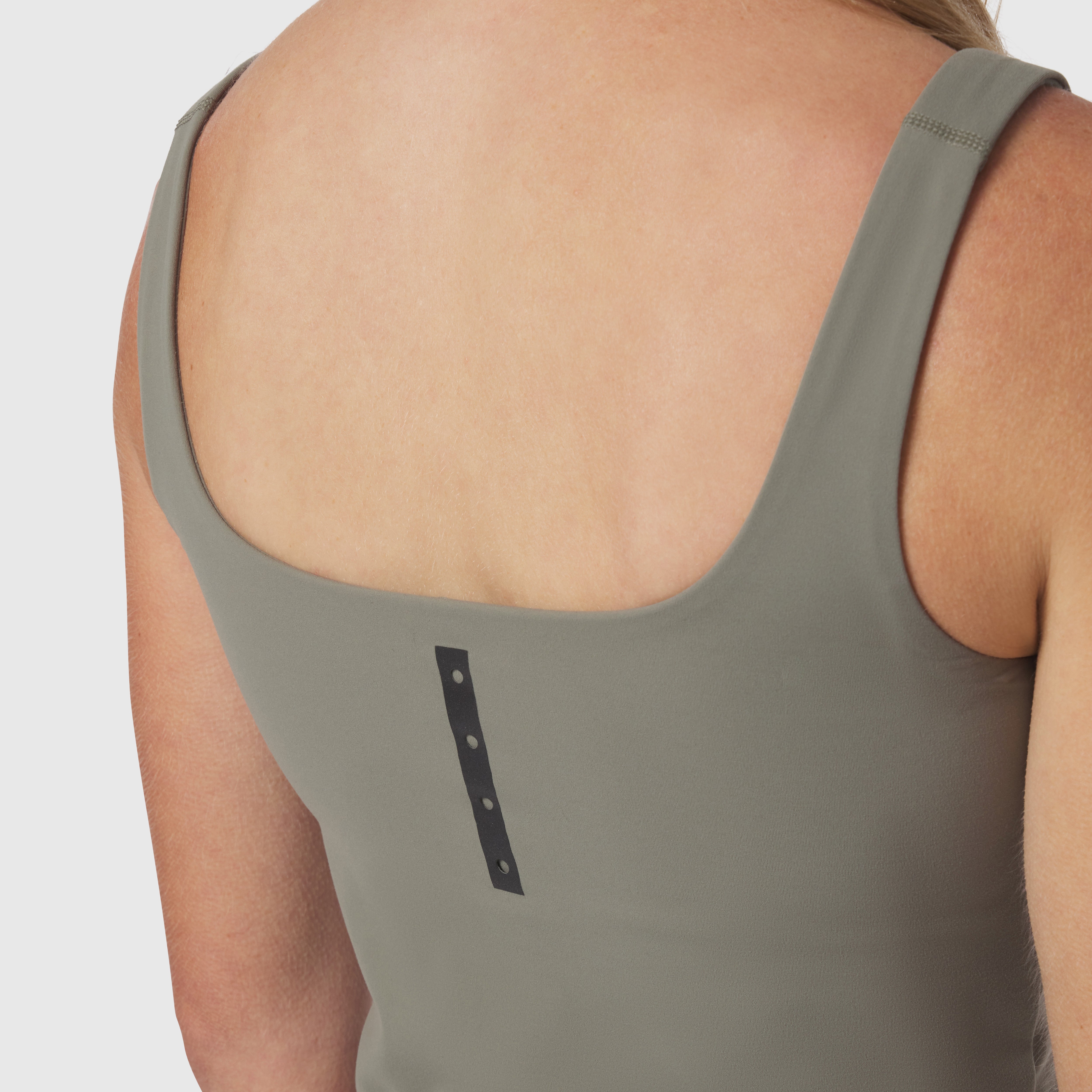 Sage LYCRA® 2-in-1 tank top worn by model, back view showing scoop neckline
