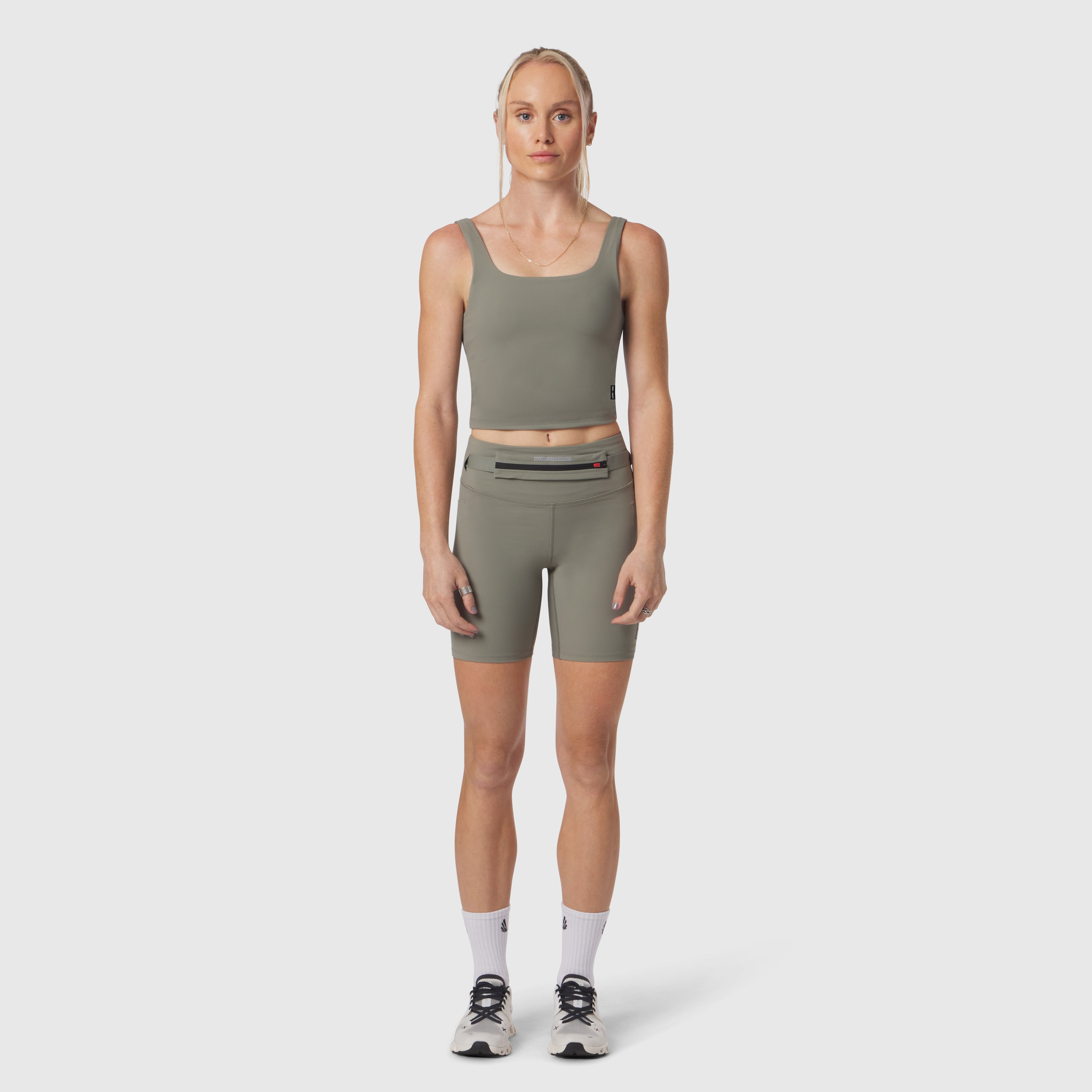 W022 Lycra 2-in-1 tank top in sage, worn by model with matching shorts, front view