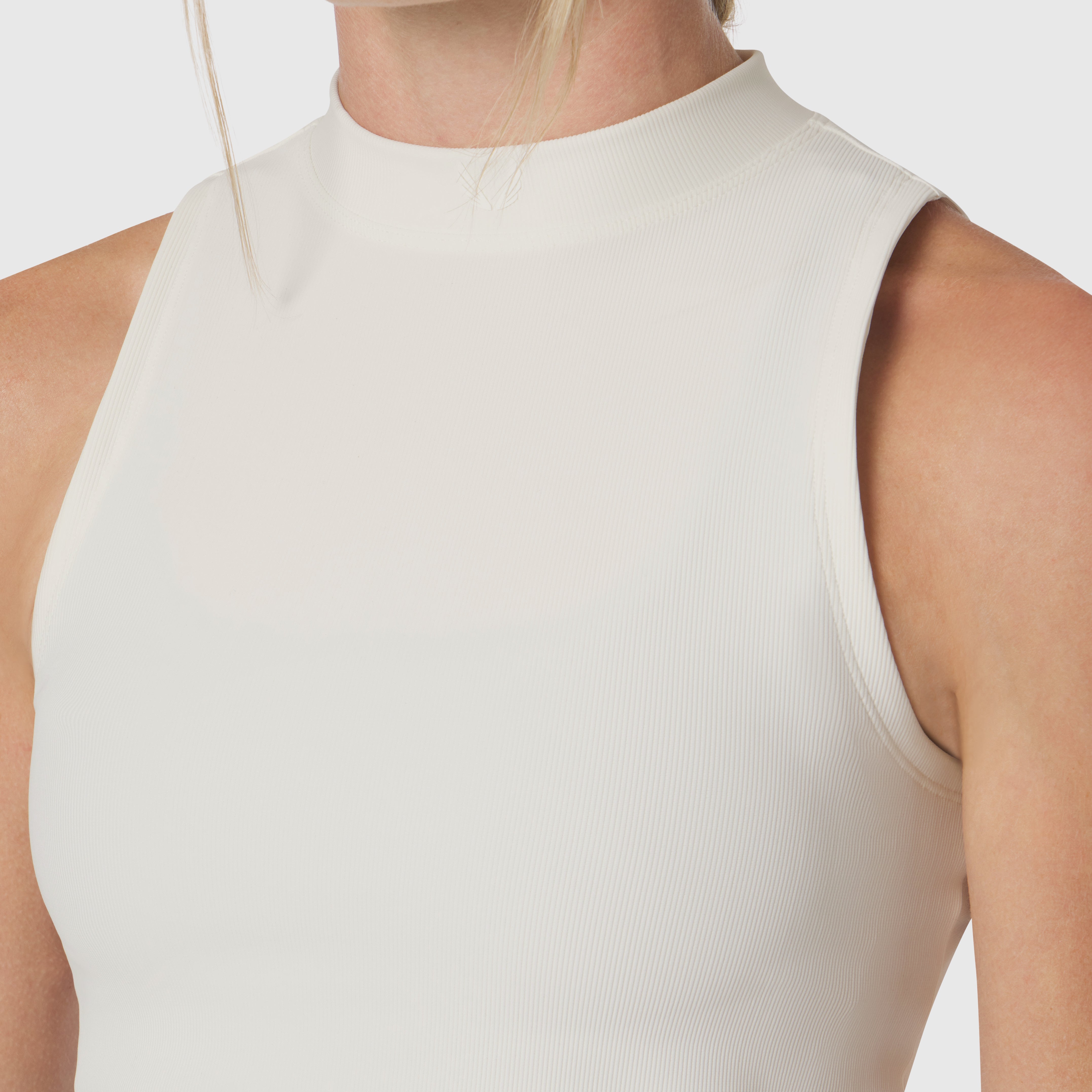 Ivory cream ribbed mockneck tank worn by model, front view