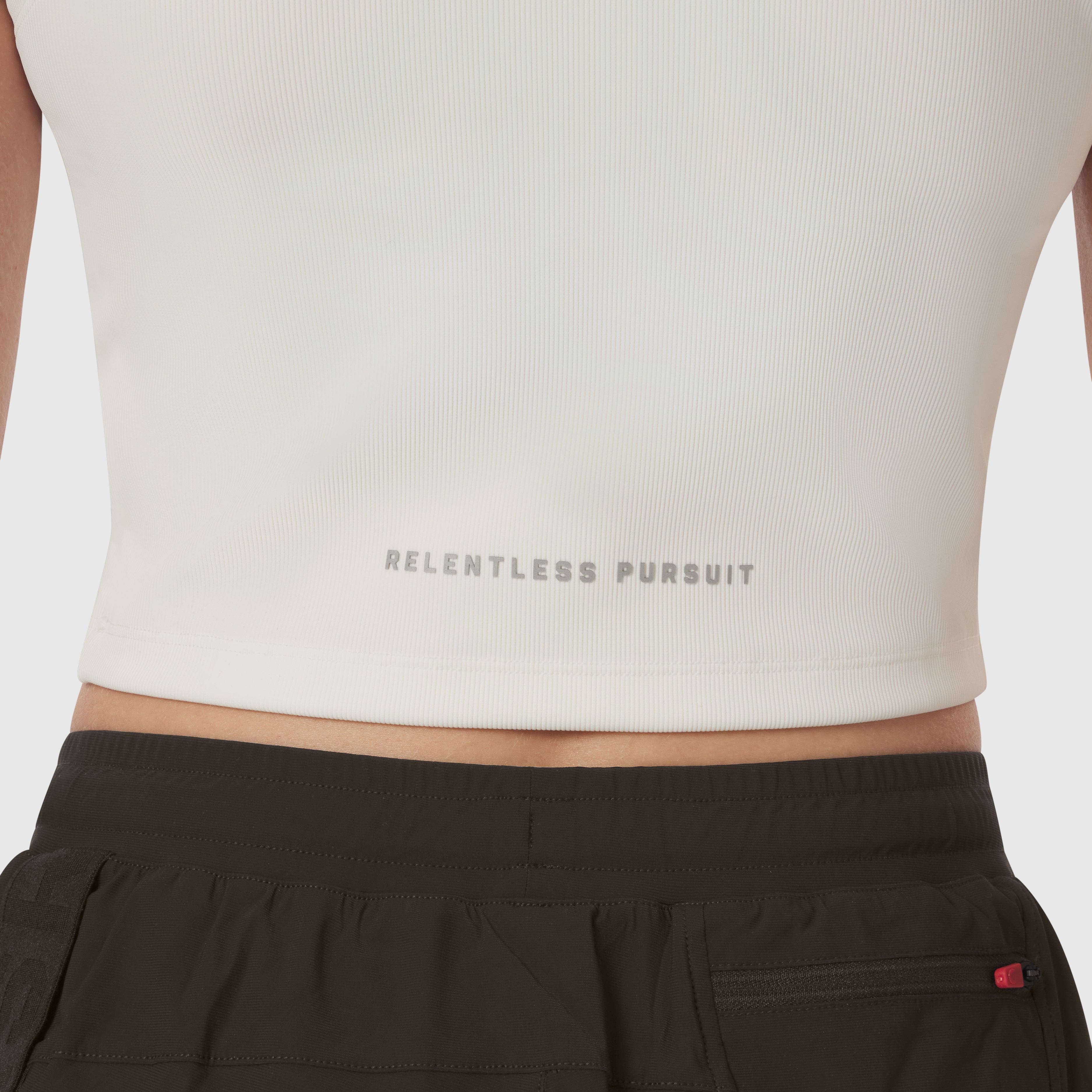 LYCRA® Ribbed Mockneck Tank in ivory cream worn with black shorts, front view