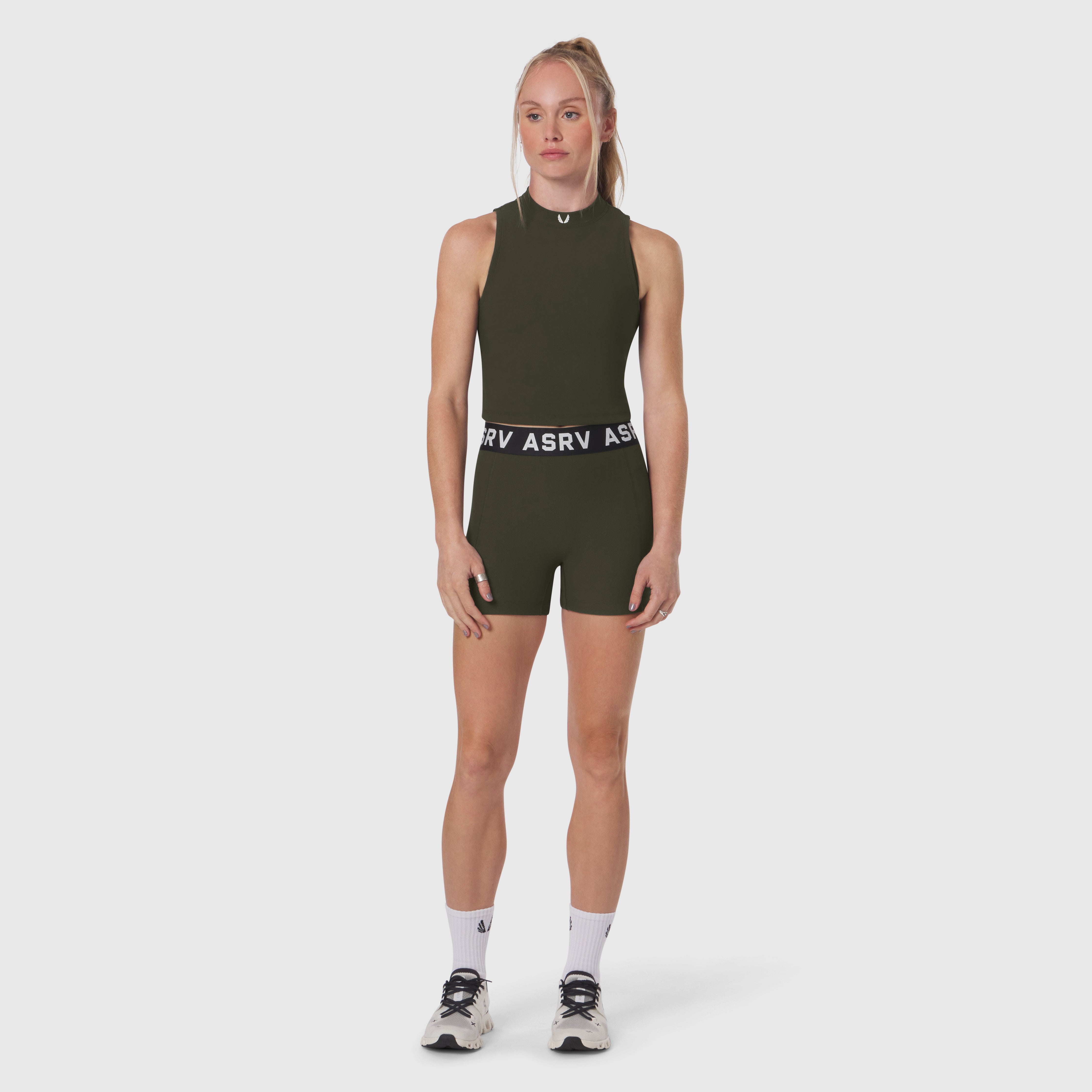 W023 Lycra Ribbed Mockneck Tank in olive, worn with matching shorts, front view