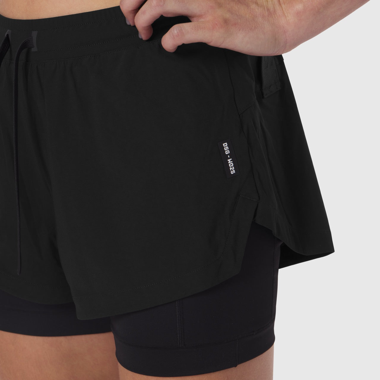 Tetra-Lite® Liner Short in black, worn by model showing side view with overlay detail