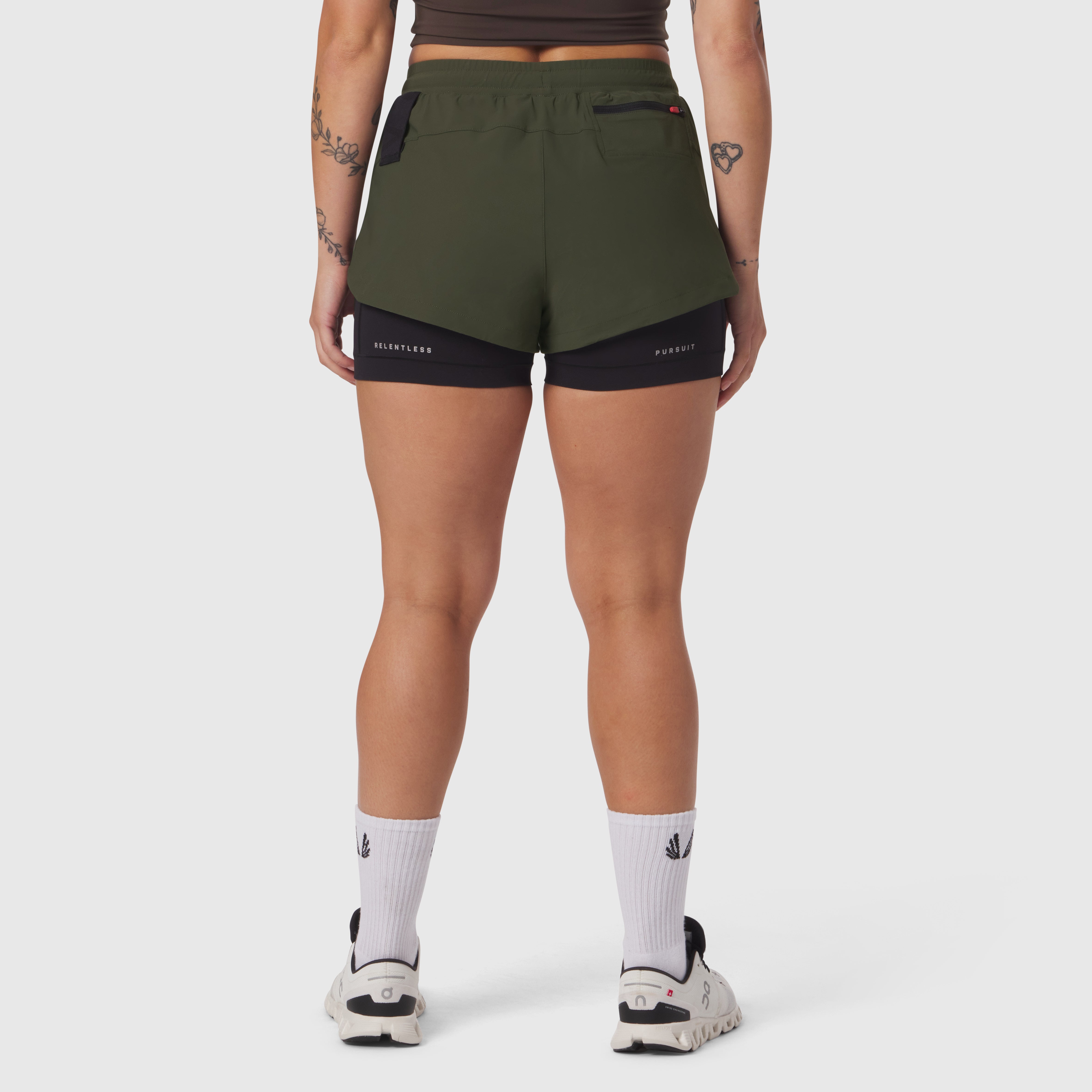Tetra-Lite Liner Short in olive and black, rear view on model with white socks