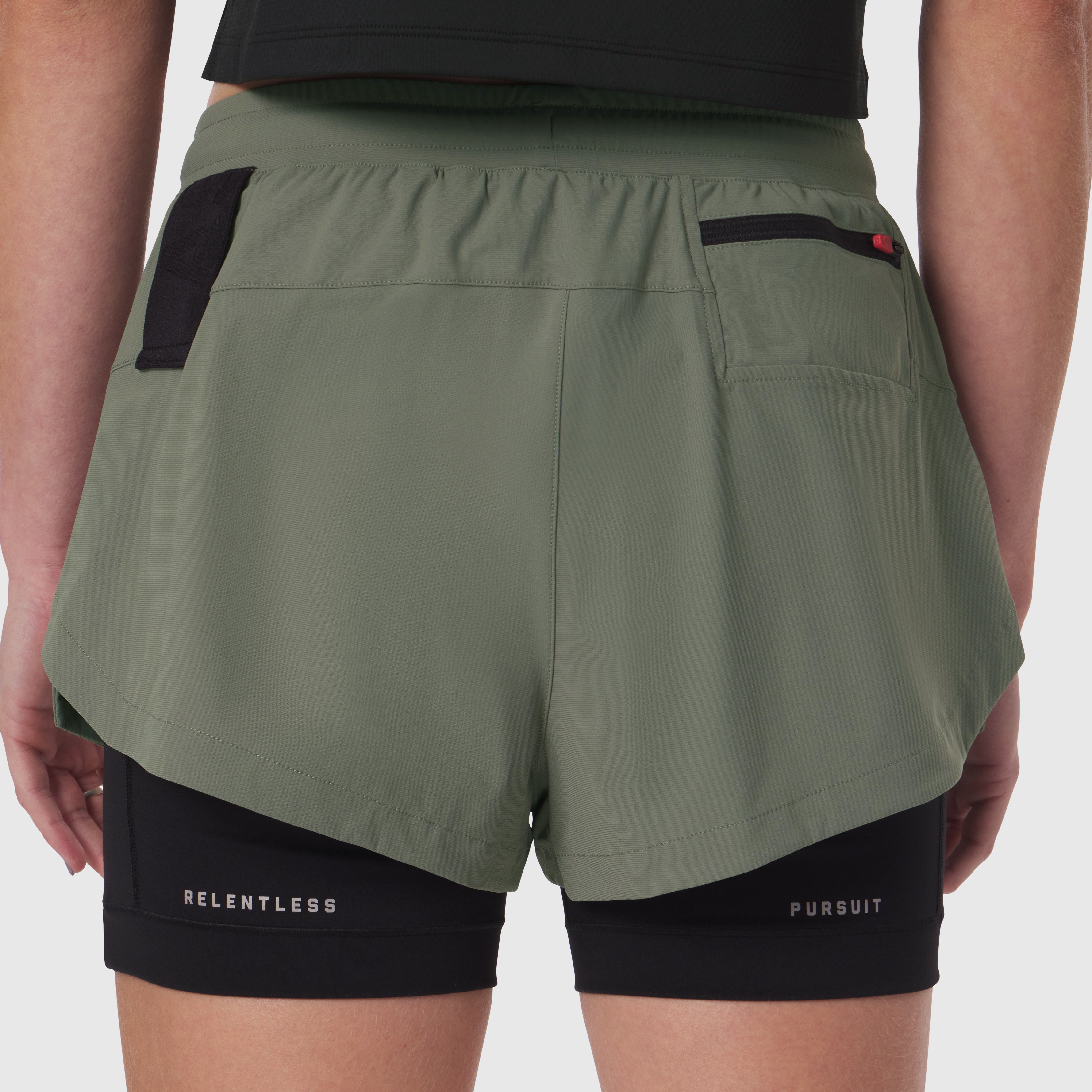 Tetra-Lite Liner Short in sage worn by model, back view showing black inner shorts