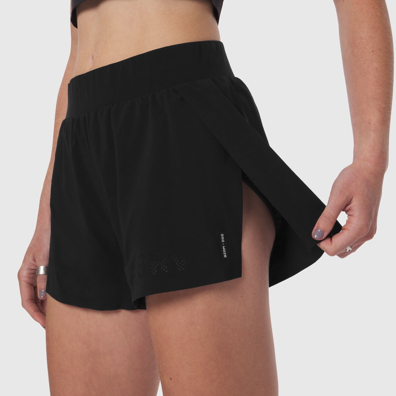 Black Aerotex side split run shorts worn by model, side view