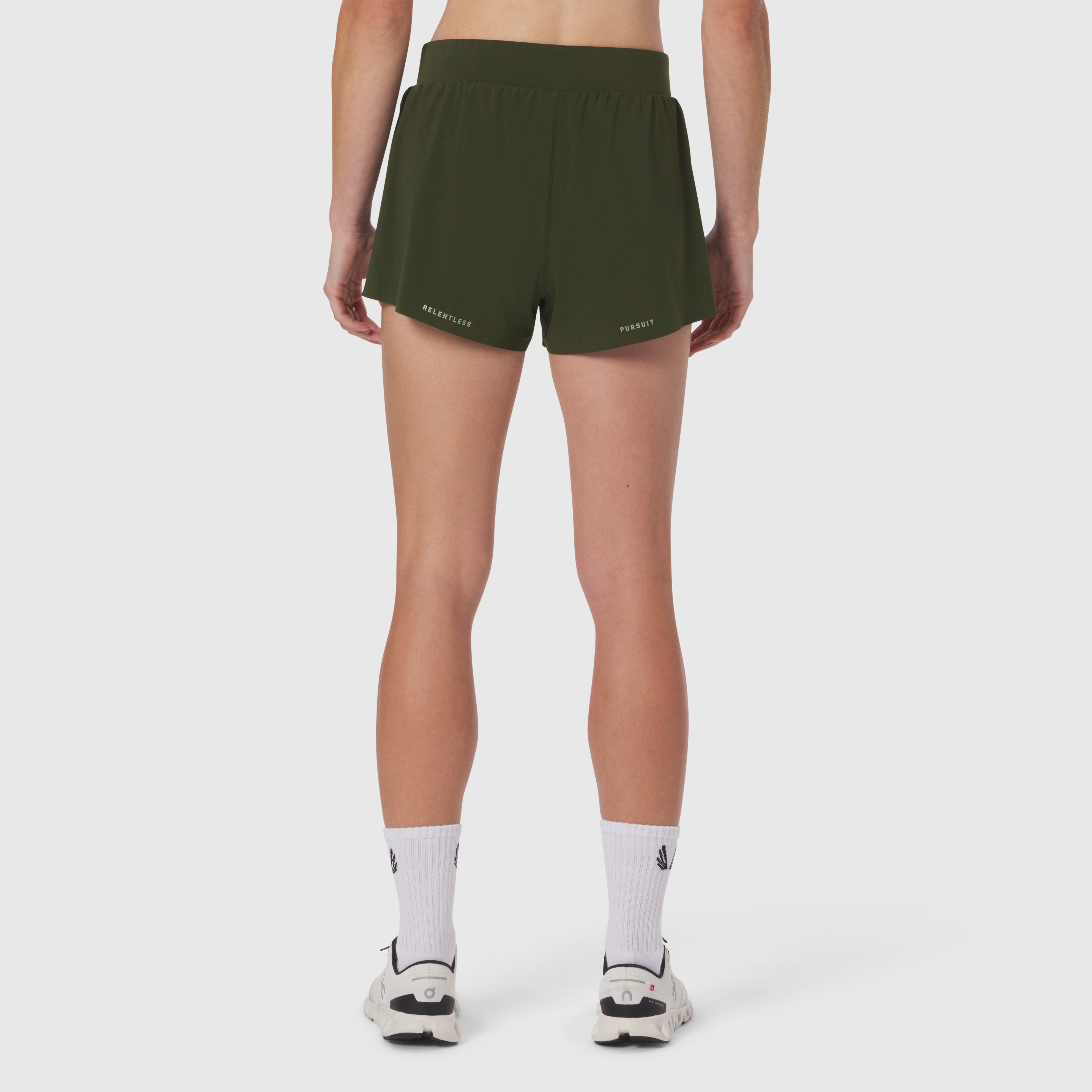 Aerotex Side Split Run Short in olive, rear view on model with white socks and sneakers