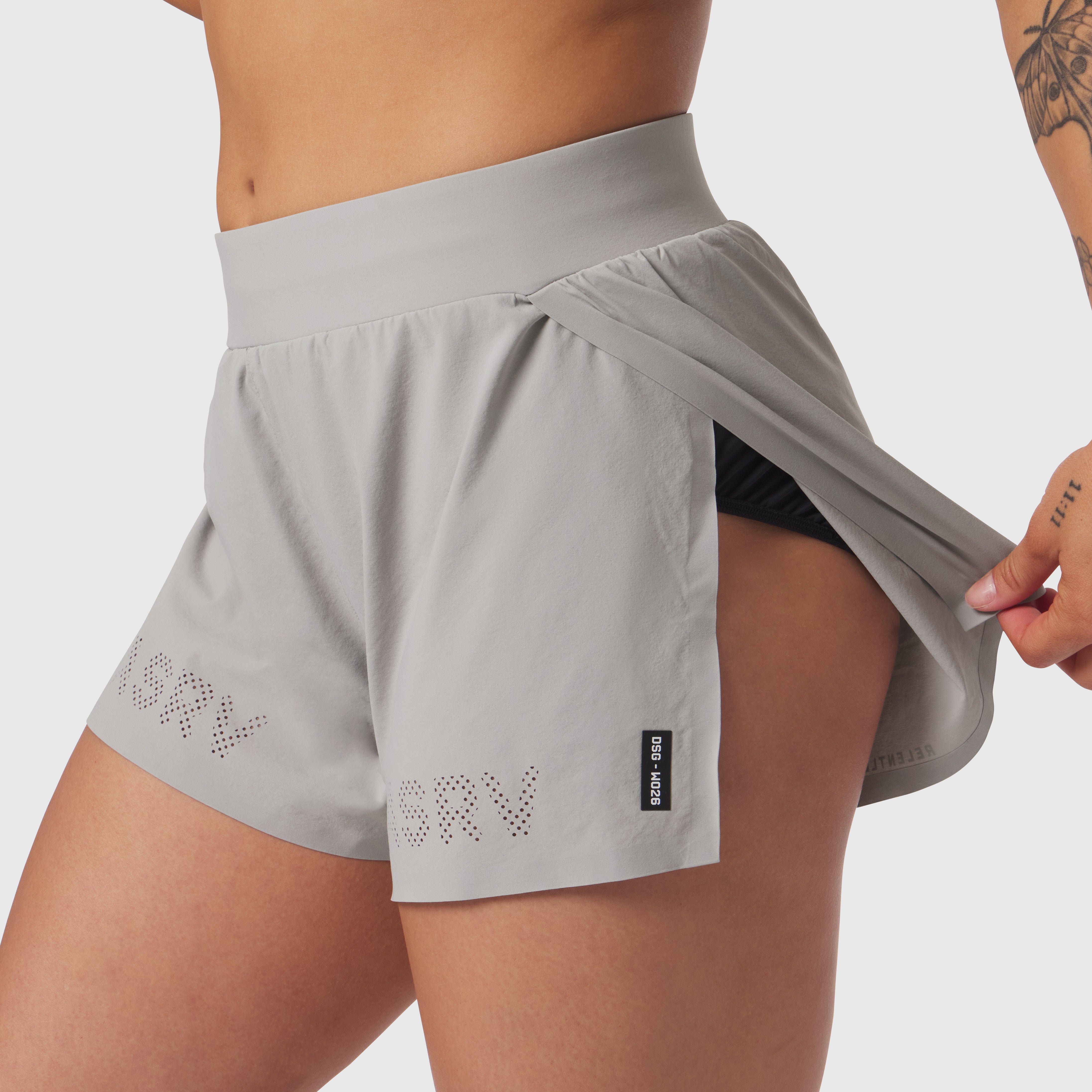 Aerotex Side Split Run Short in slate grey, worn by model showing side split detail and black inner shorts