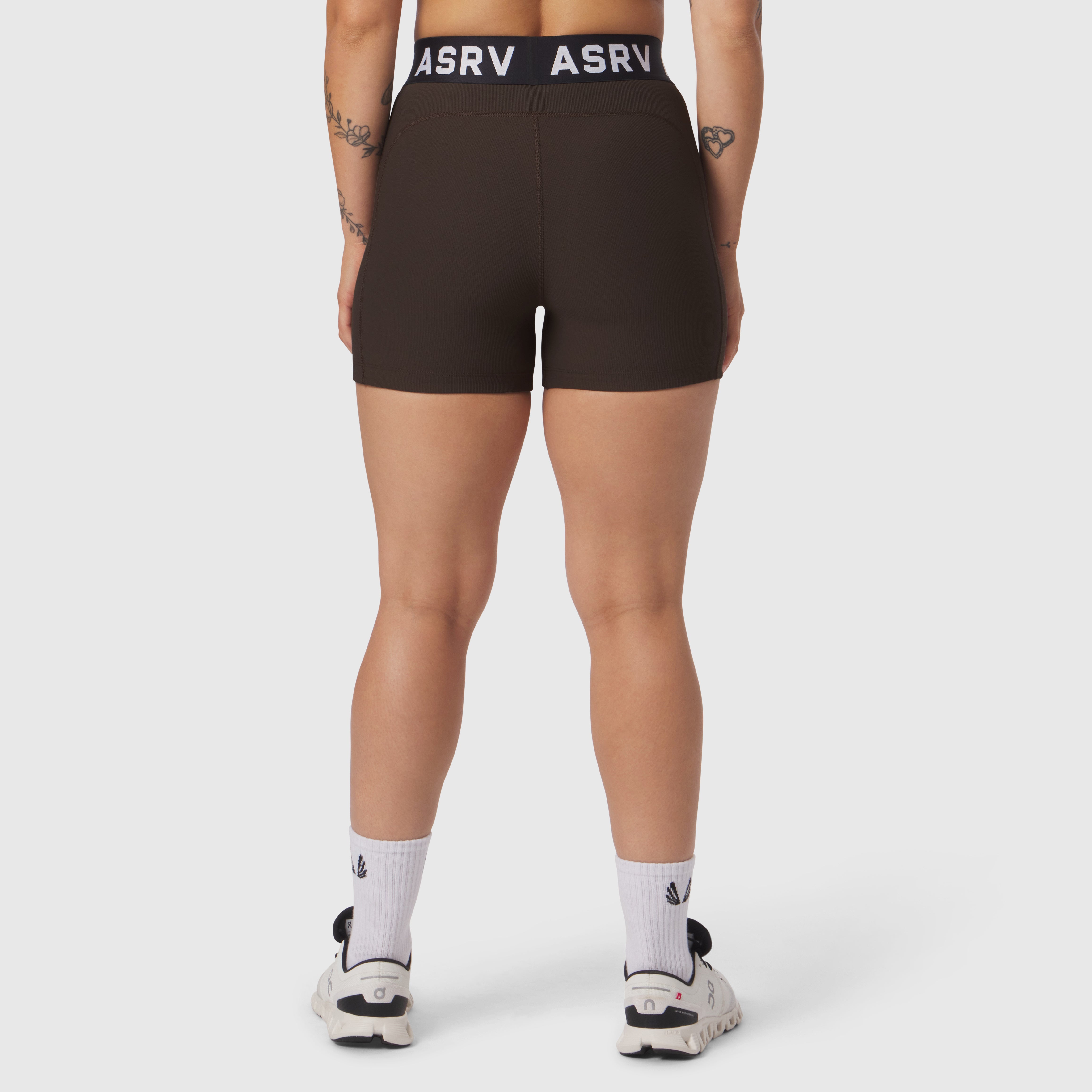 W027 Lycra Ribbed Short in dark earth, worn by model shown from behind