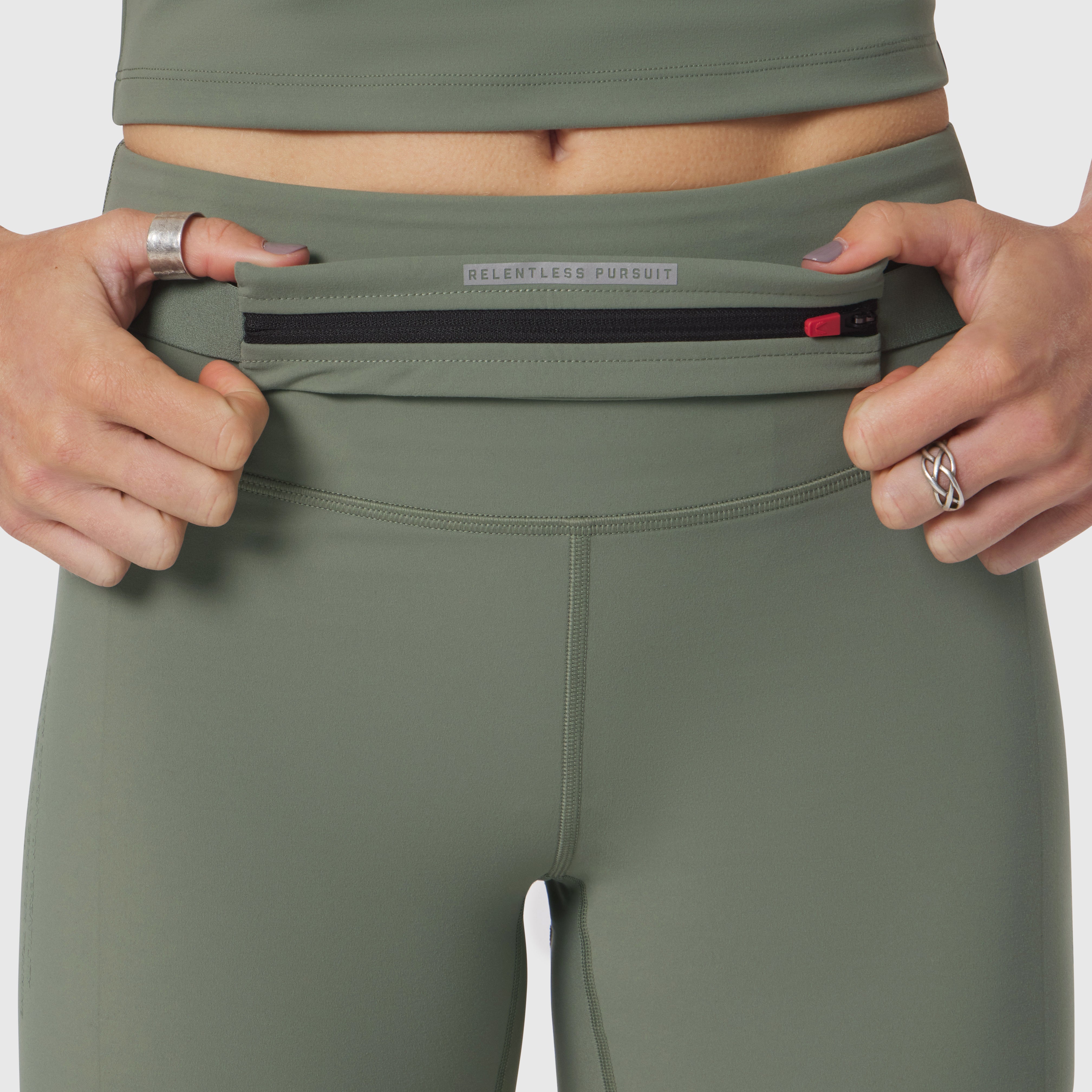 Lycra 3-in-1 Biker Short in sage worn by model, waistband detail view