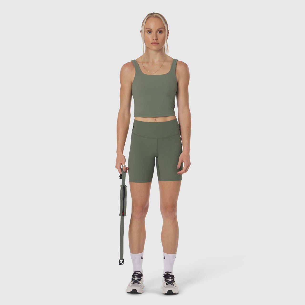 LYCRA® 3-in-1 Biker Short in sage, worn by model holding jump rope