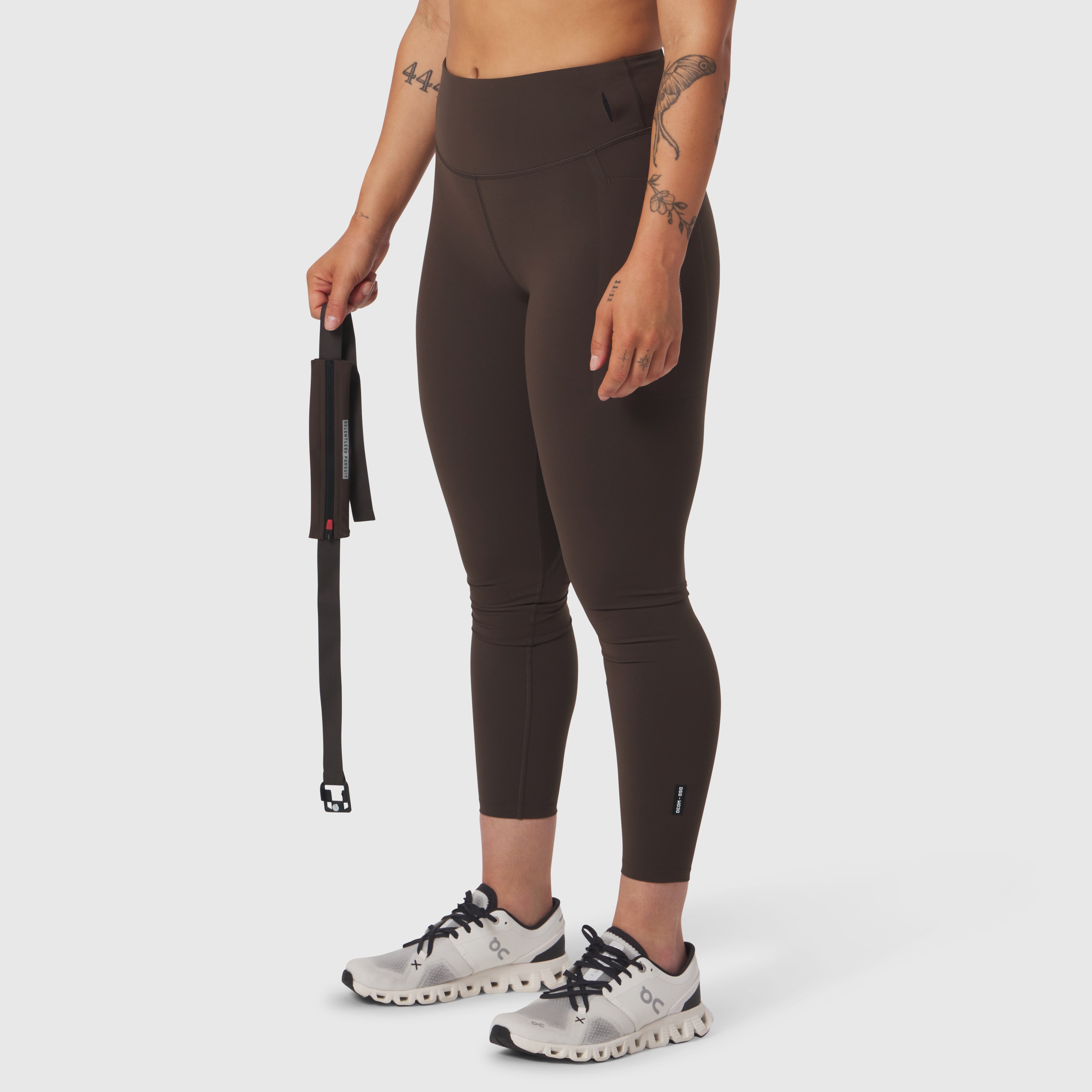 W030 LYCRA® 3-in-1 Legging in Dark Earth, model wearing capri leggings with jump rope