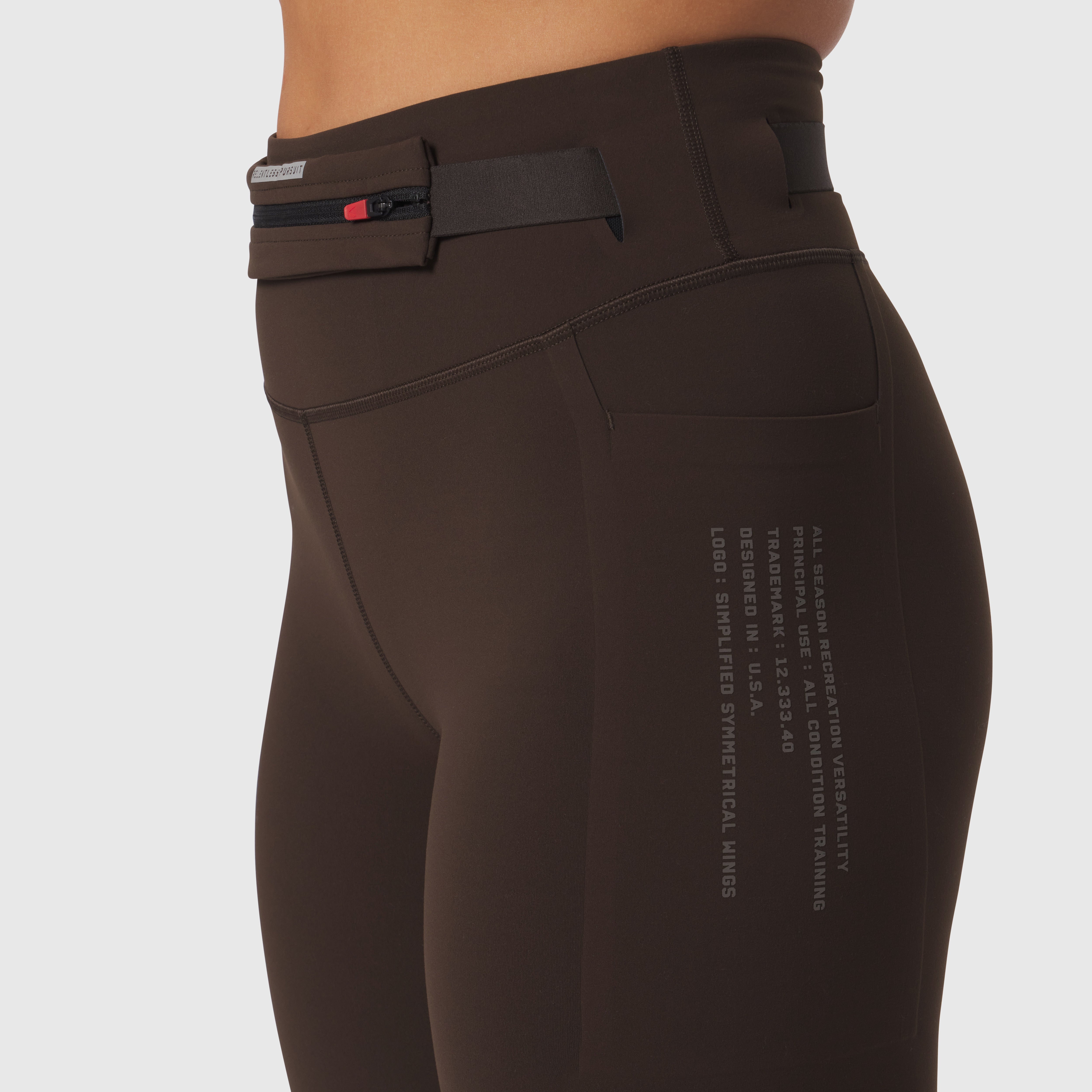 W030 LYCRA® 3-in-1 Legging in Dark Earth, side view on model