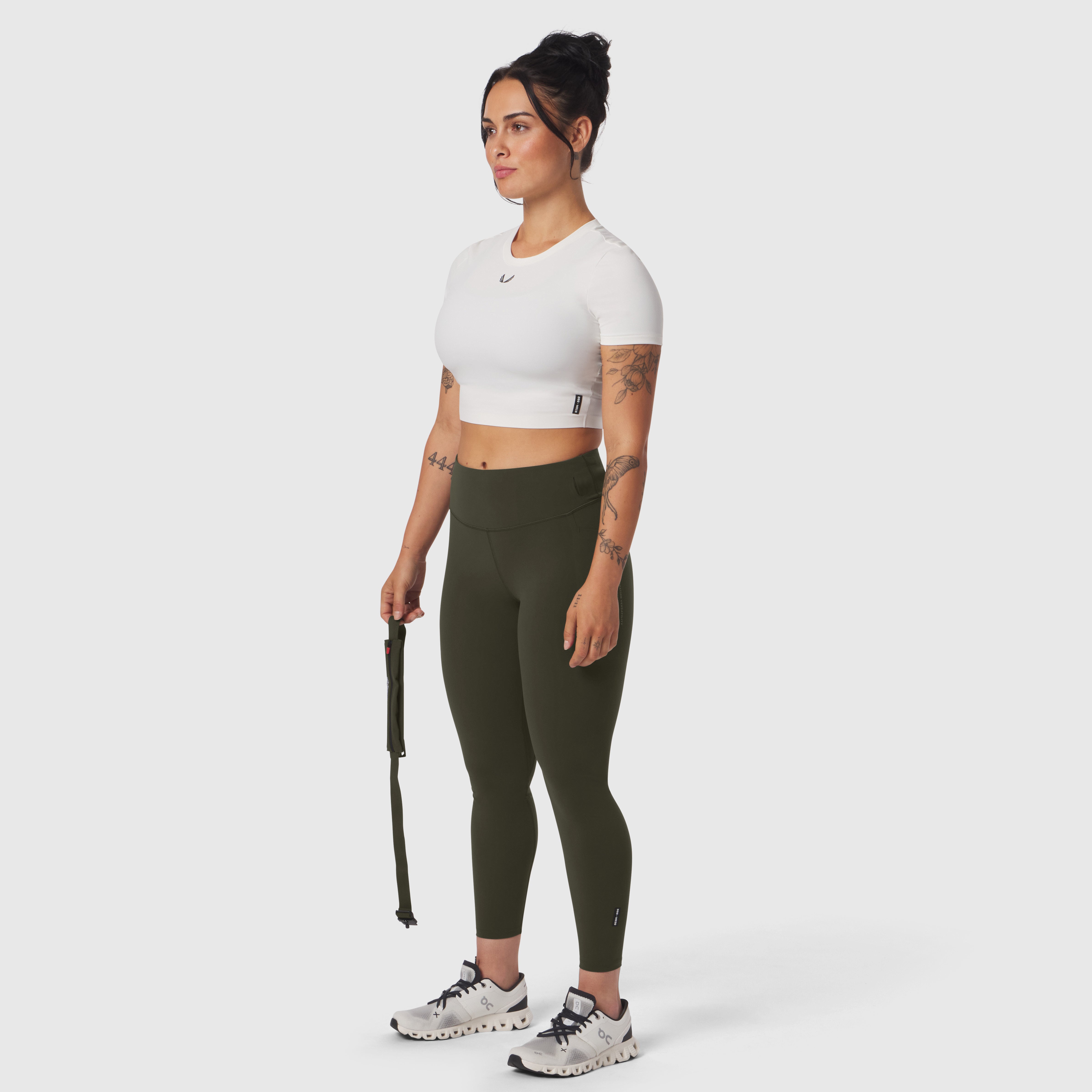 W030 LYCRA® 3-in-1 Legging in olive, model wearing with white crop top and sneakers