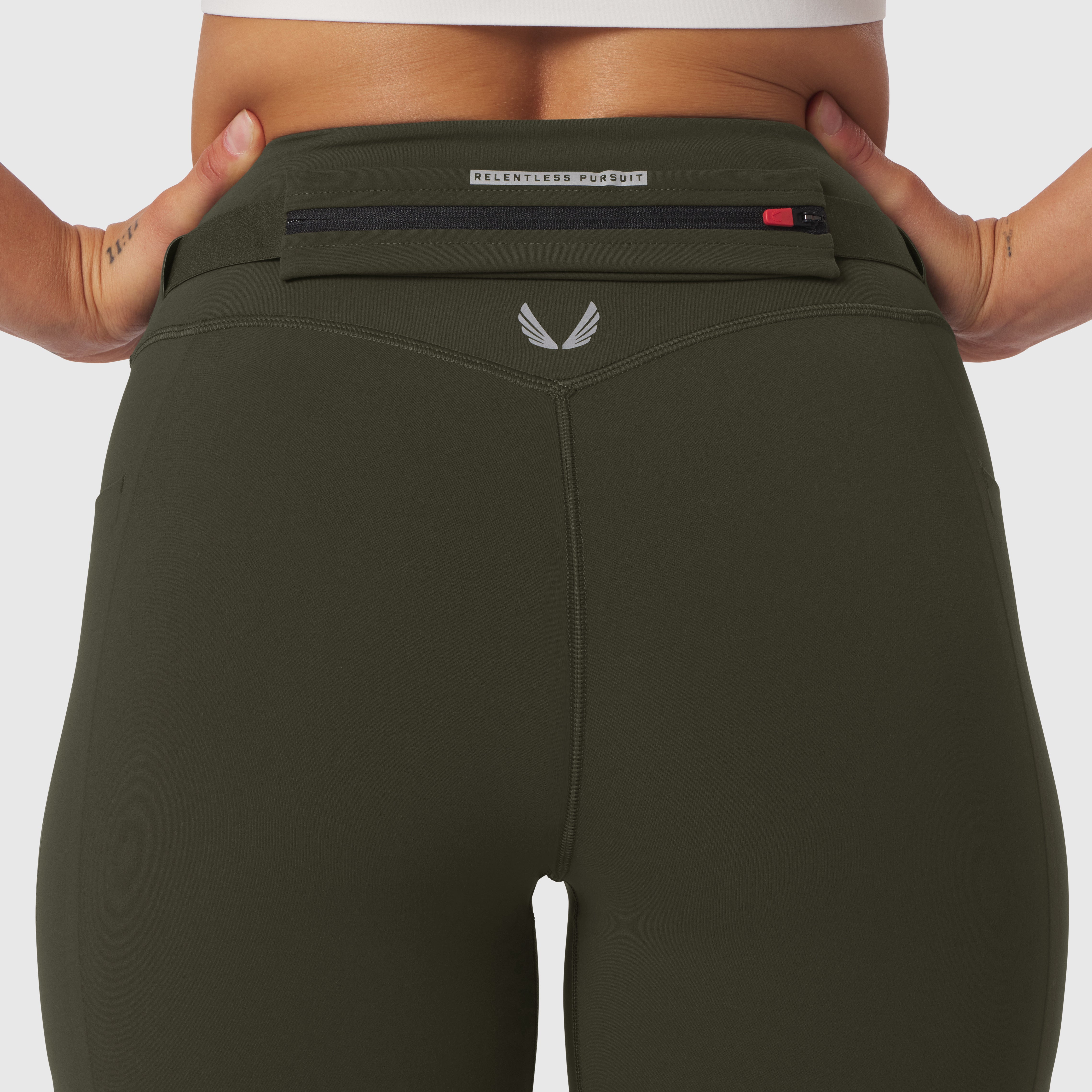 W030 LYCRA® 3-in-1 Legging in olive, worn by model showing waistband detail