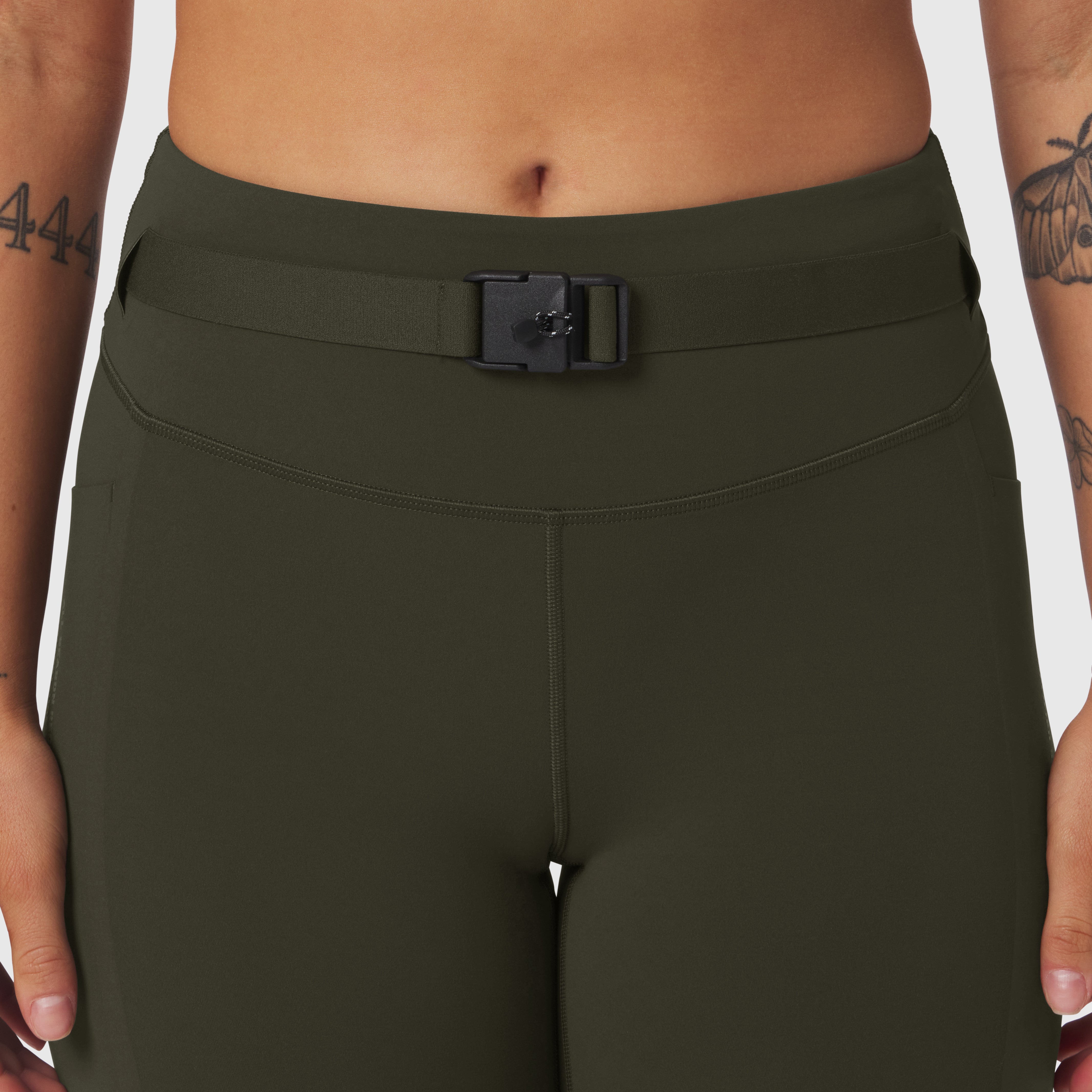 W030 LYCRA® 3-in-1 Legging in olive, worn by model, front waist detail