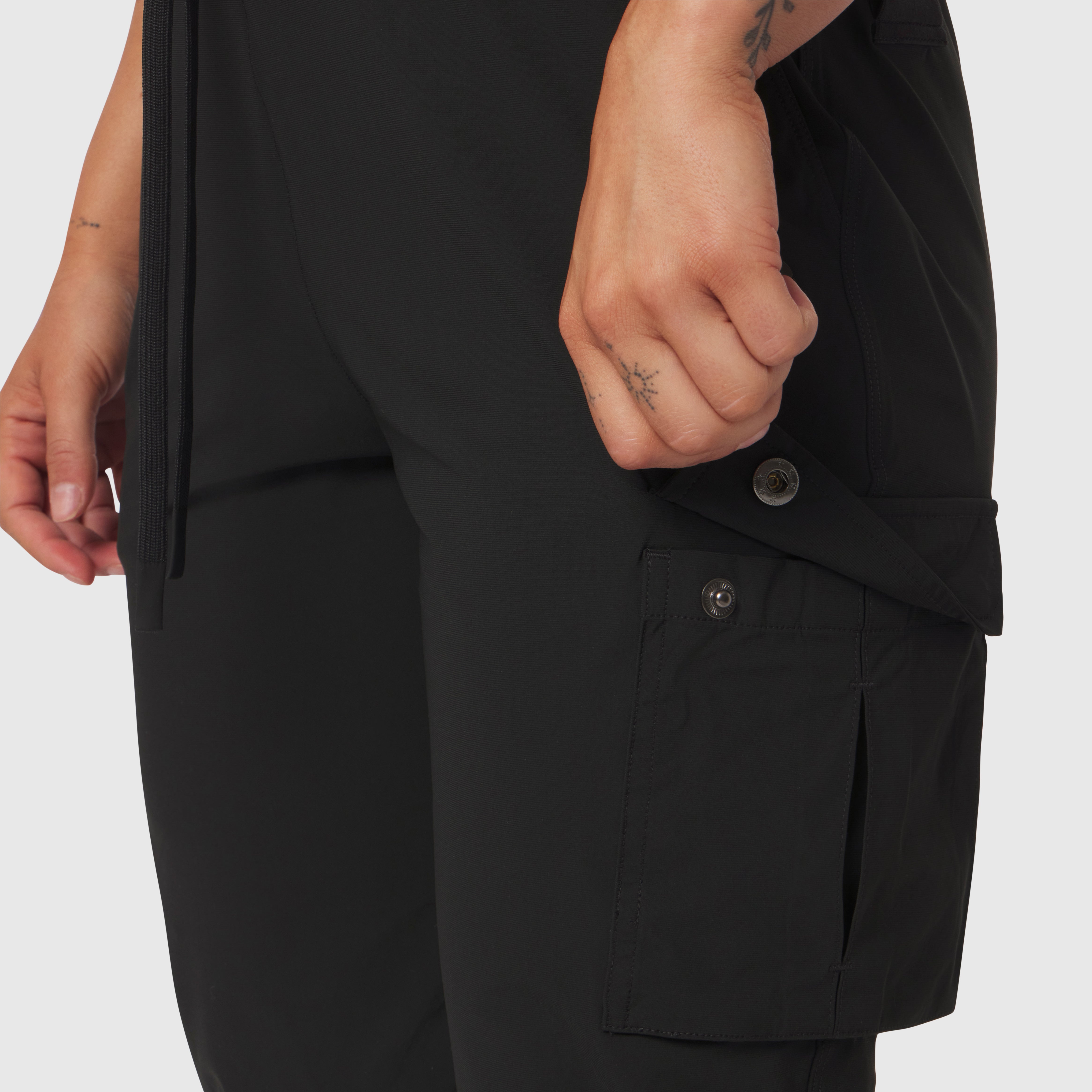 Tetra-Lite® Cargo High Rib Jogger in black, worn by model showing side cargo pocket detail