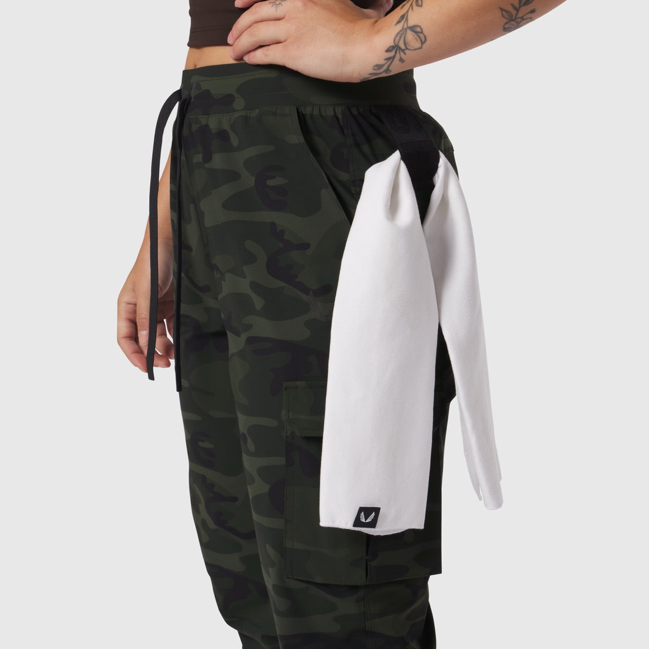 Tetra-Lite® Cargo High Rib Jogger in Dark Camo, worn by model showing side view with white towel