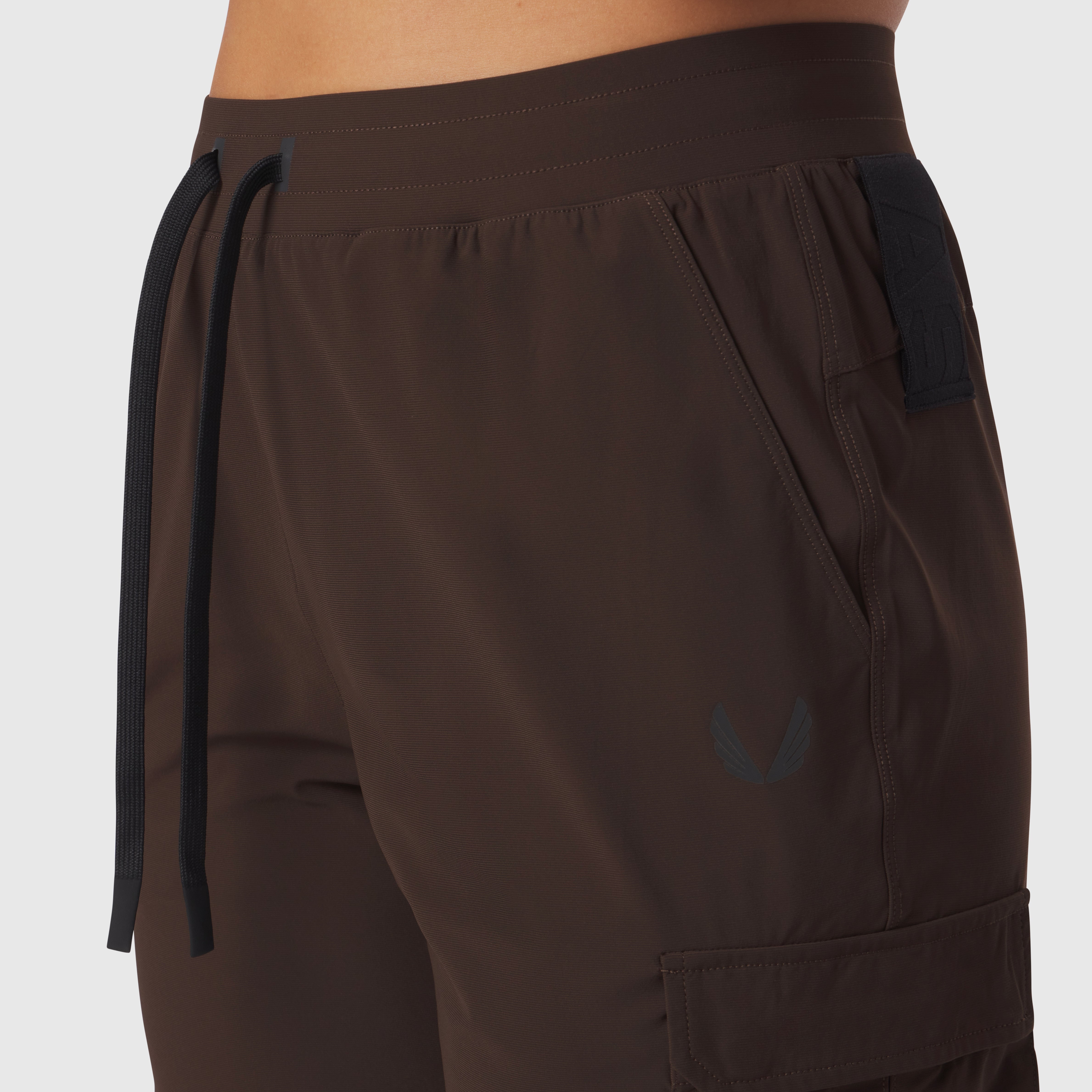 Tetra-Lite Cargo High Rib Jogger in Dark Earth, worn on model, side view