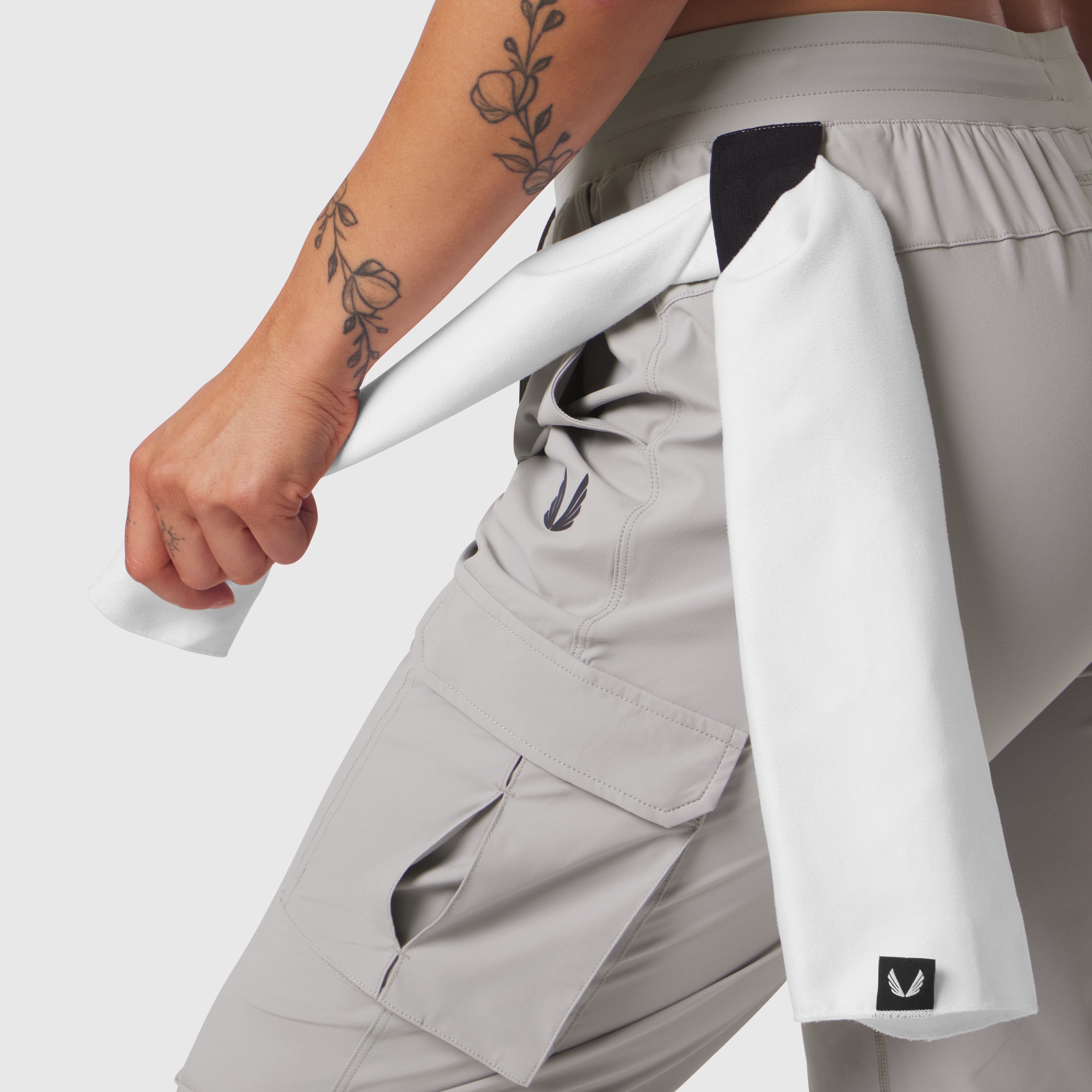 Tetra-Lite® Cargo High Rib Jogger in Slate Grey, worn with white jacket, side view