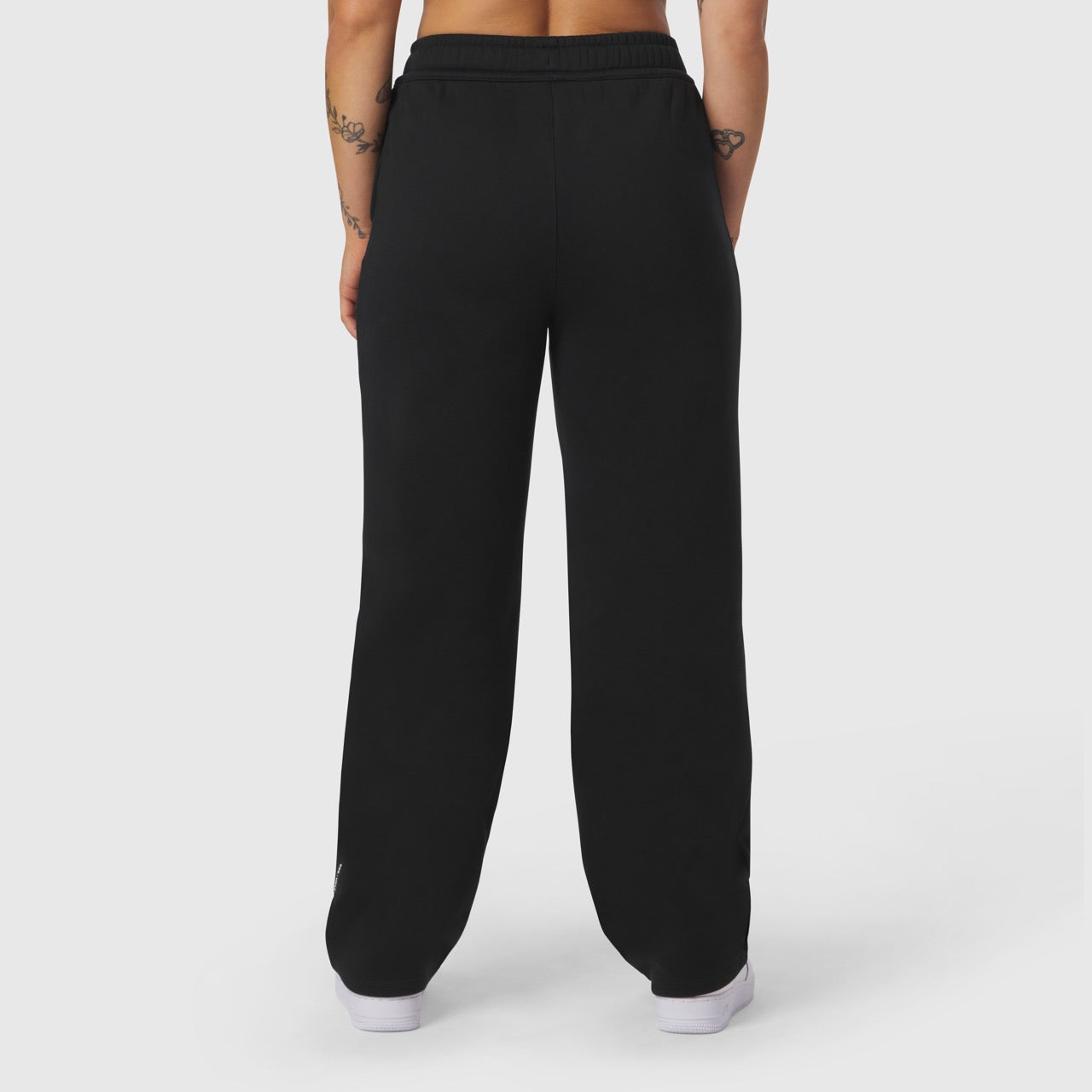 Black Sorona® Terry straight leg sweats worn by model, back view