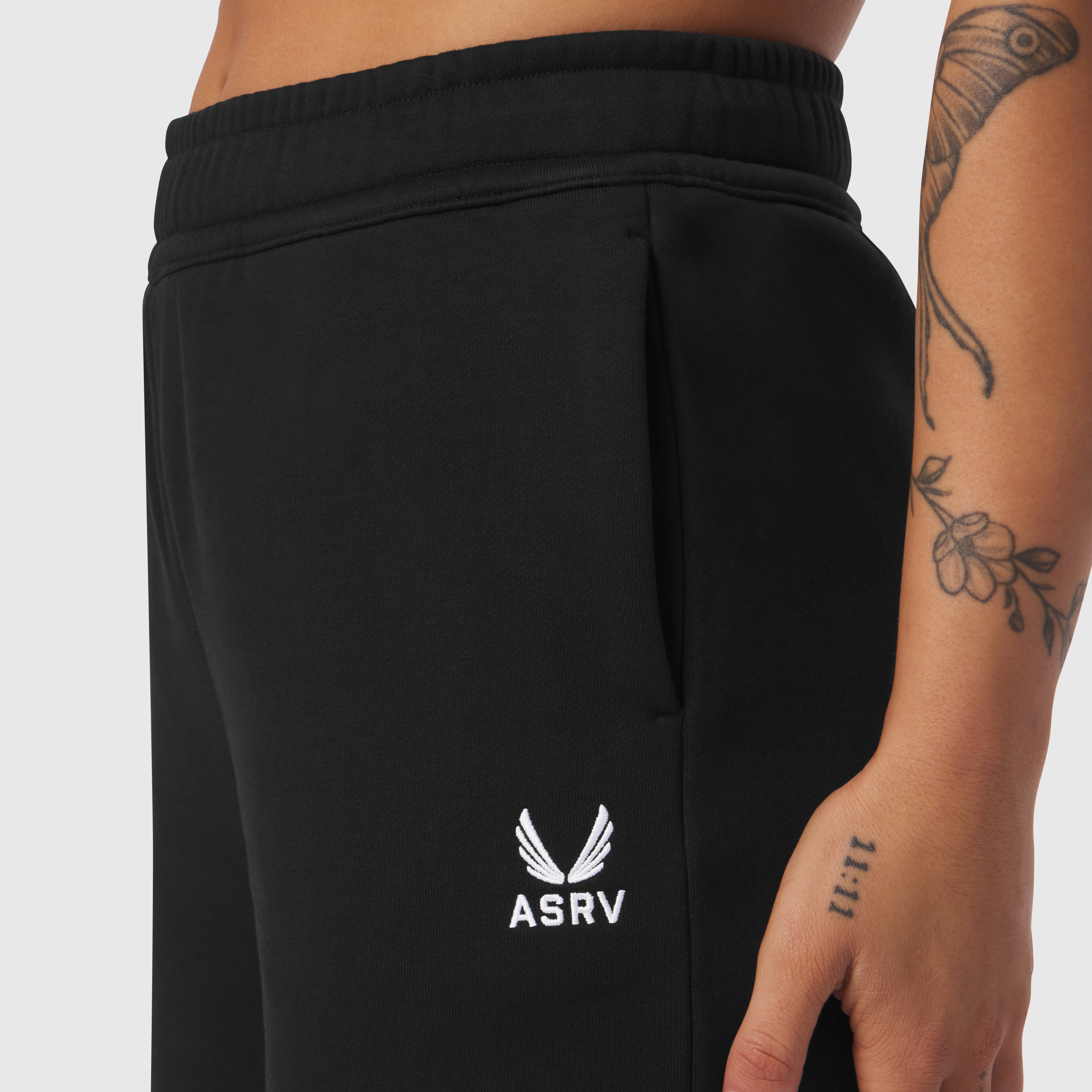 Black Sorona® Terry straight leg sweats on model, side view with ASRV logo visible