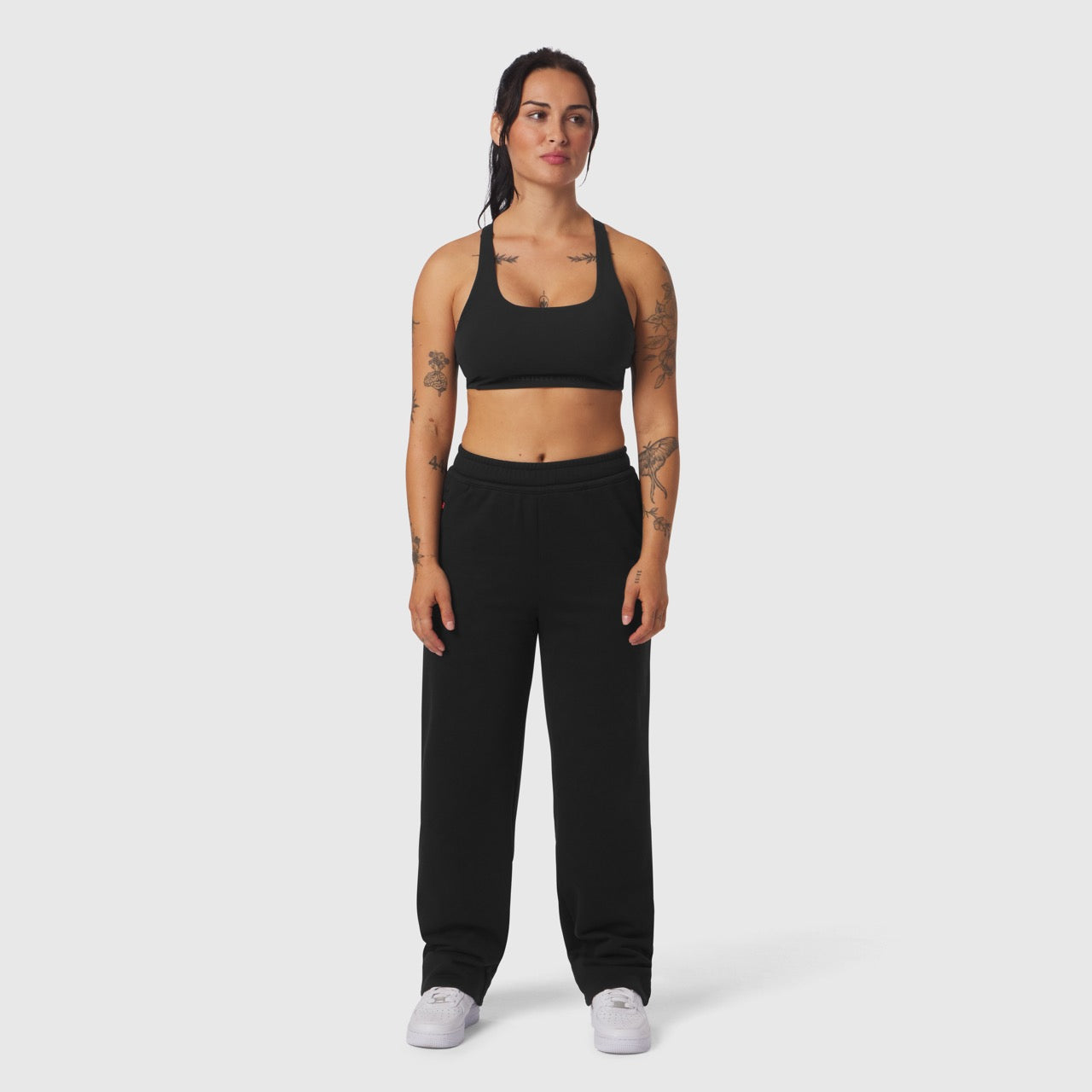 Black Sorona® Terry straight leg sweats on model, front view